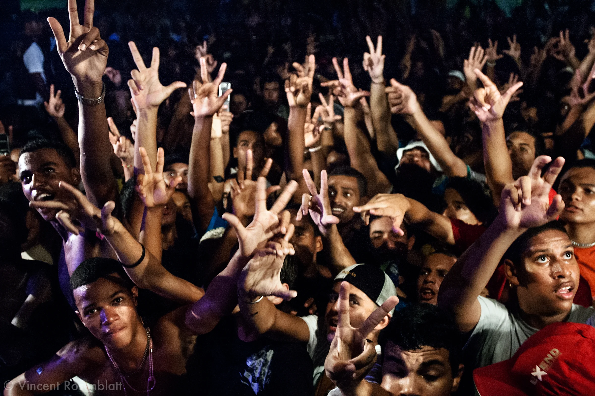 Description/Caption:
"Baile" of Furacão Tsunami, the most powerful soundsystem on the Funk scene in Rio. Club Boqueirão, downtown Rio de Janeiro . Every hand gesture has a meaning : 3 fingers apart mean "Vida louca" (crazy life), the C and V letters symbolize the Commando Vermelho, the principal drug faction in Rio's favelas.