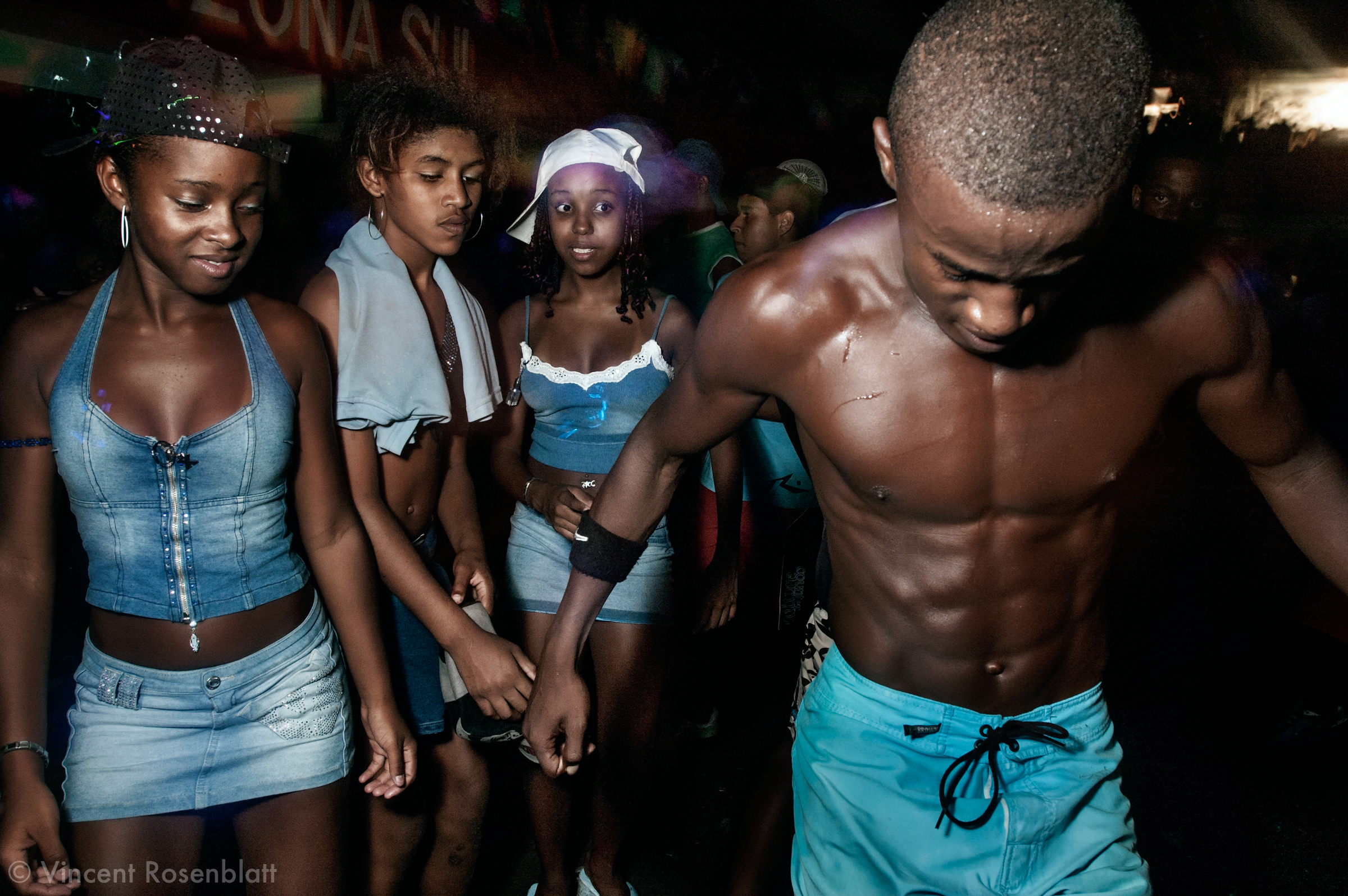  Ball at the Morro do Cantagalo, Ipanema, Rio de Janeiro. As a contrast to rap the "baile funk" in the favela is a stage for discipline and respect, being a girl or a boy, a dancer or a junkie. It's a moment of dignity, pride, collective choreographi