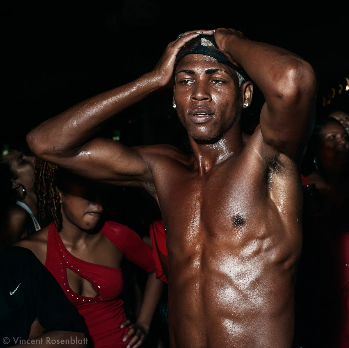 A funkeiros' boys band ("Os Feras" - The beasts) during a baile in Favela da Gamba, Complexo do Lins, Northern zone, Rio de Janeiro 2009. Many times, the show ends with a hint of a strip tease, under the girls'cheers..