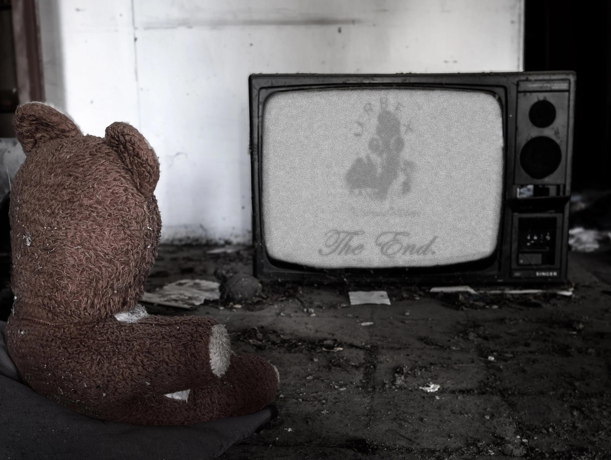 Transmission Lost.

An old television flickers with static.
In front of it, a small teddy bear still watches.

The signal is gone.
The room is silent.