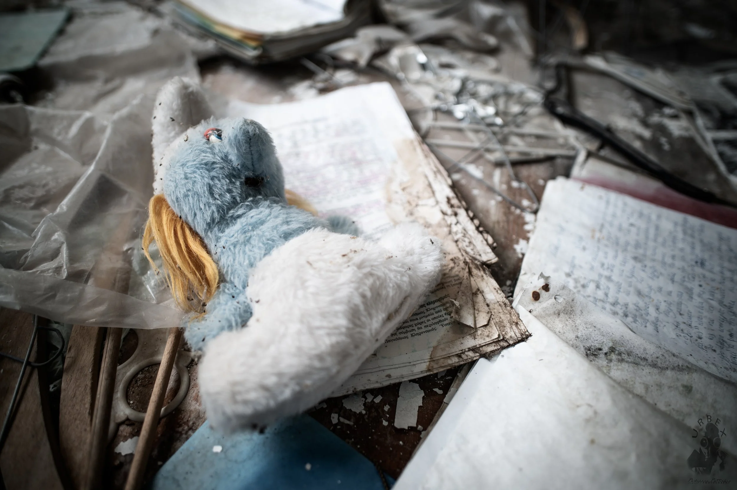 Left on the Floor.


A small toy lies on top of old notebooks and scattered pages.
Schoolwork, drawings, forgotten notes.

Dust has settled over everything,
but the traces of a life once lived here remain.