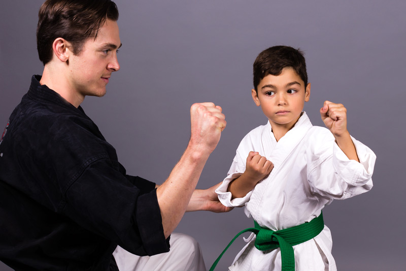 Mr. Woehler teaching student in one-on-one private karate lesson.