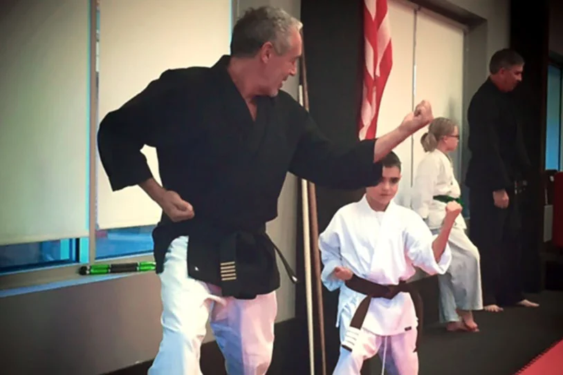 Mr. Sutton teaching student at American Karate