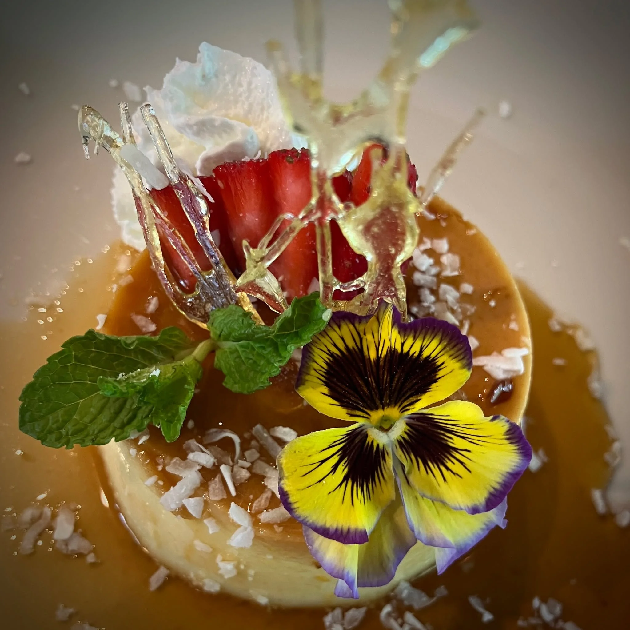 Our coconut flan is back this week, with orange caramel and seasonal garnish. A nice way to linger a little longer over dinner.