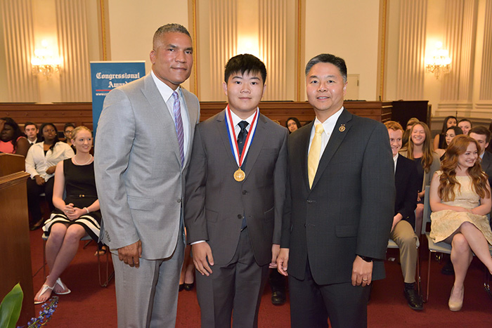 Courtesy of Fritz PhotoGraphics Terence Lee, center, wearing his Congressional Award Gold Medal, is flanked by Congressional Award Chairman Paxton K. Baker, left, and U.S. Rep. Ted Lieu.