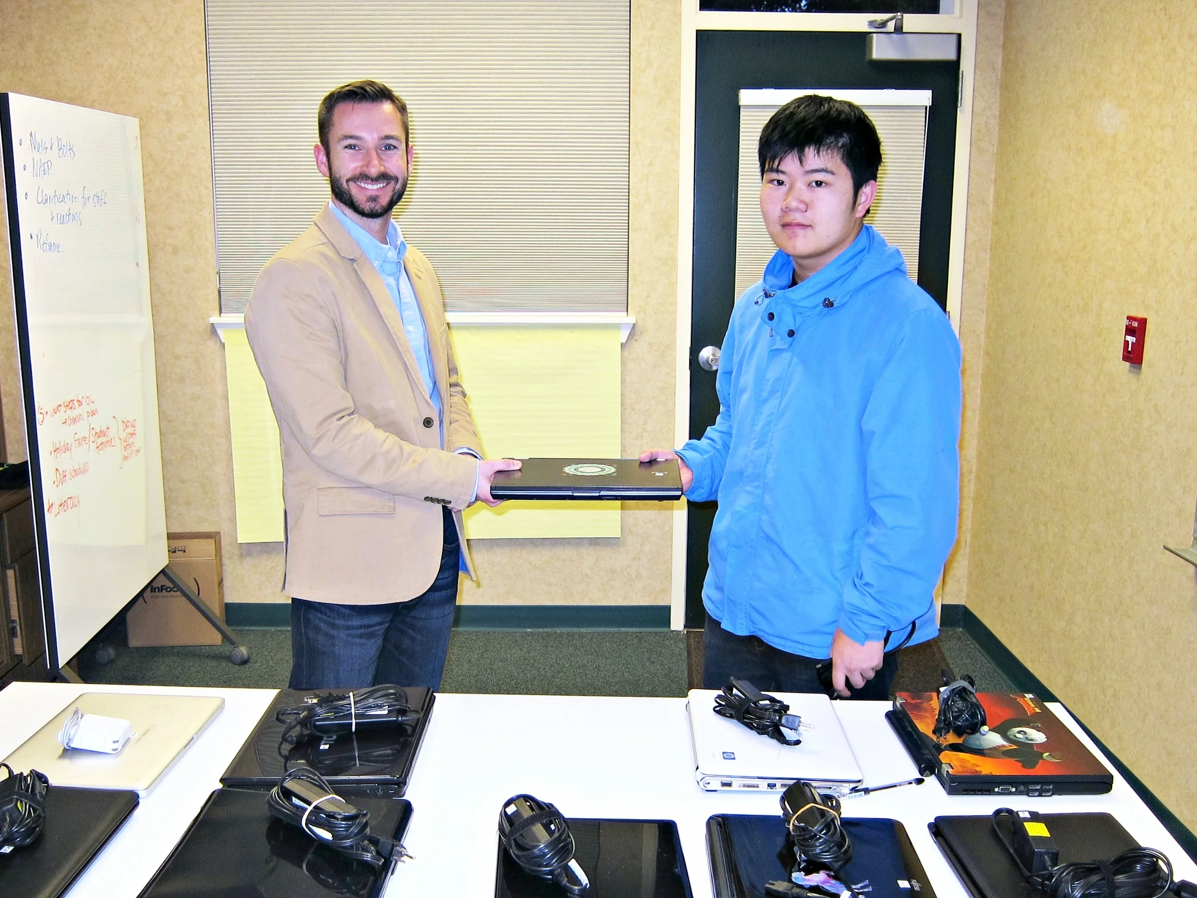Egan Junior High Principal Keith Rocha (left) and Terence Lee, EqOpTech Founder