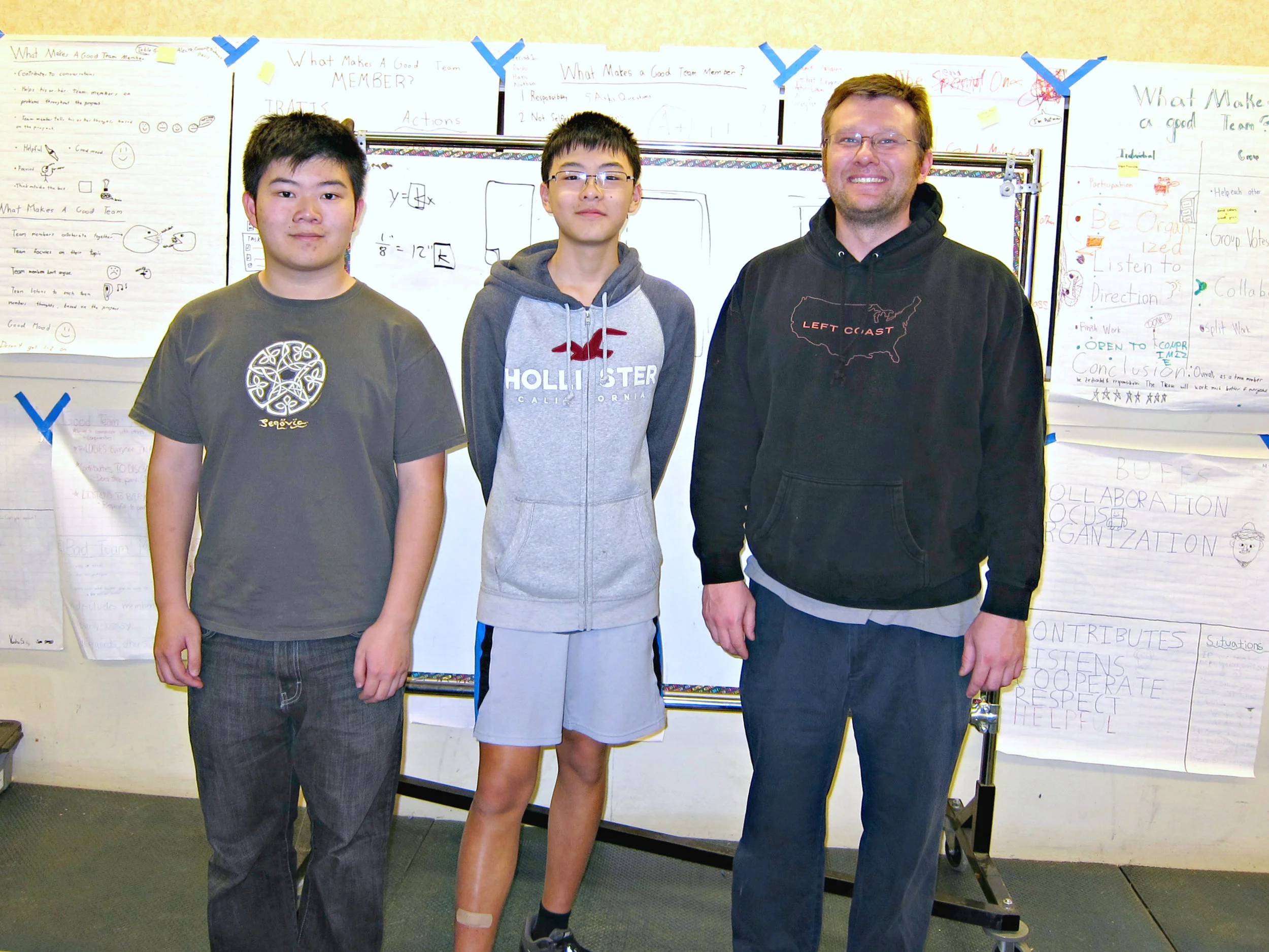 Computer-in-a-Box instructors: Terence Lee, Daniel Lim, Egan Teacher Peter Swenson (left to right)