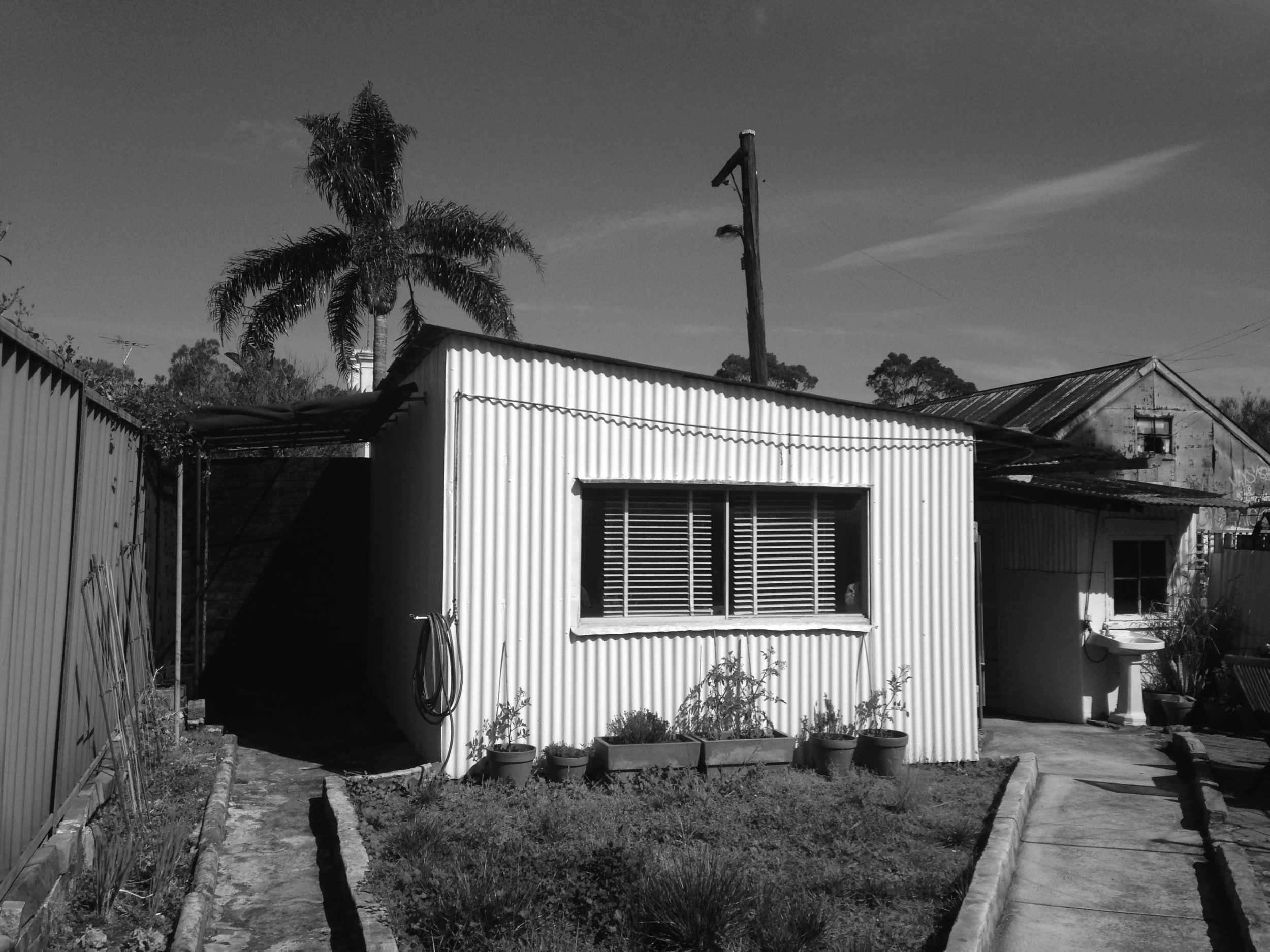 Before Shot - Garage in Backyard