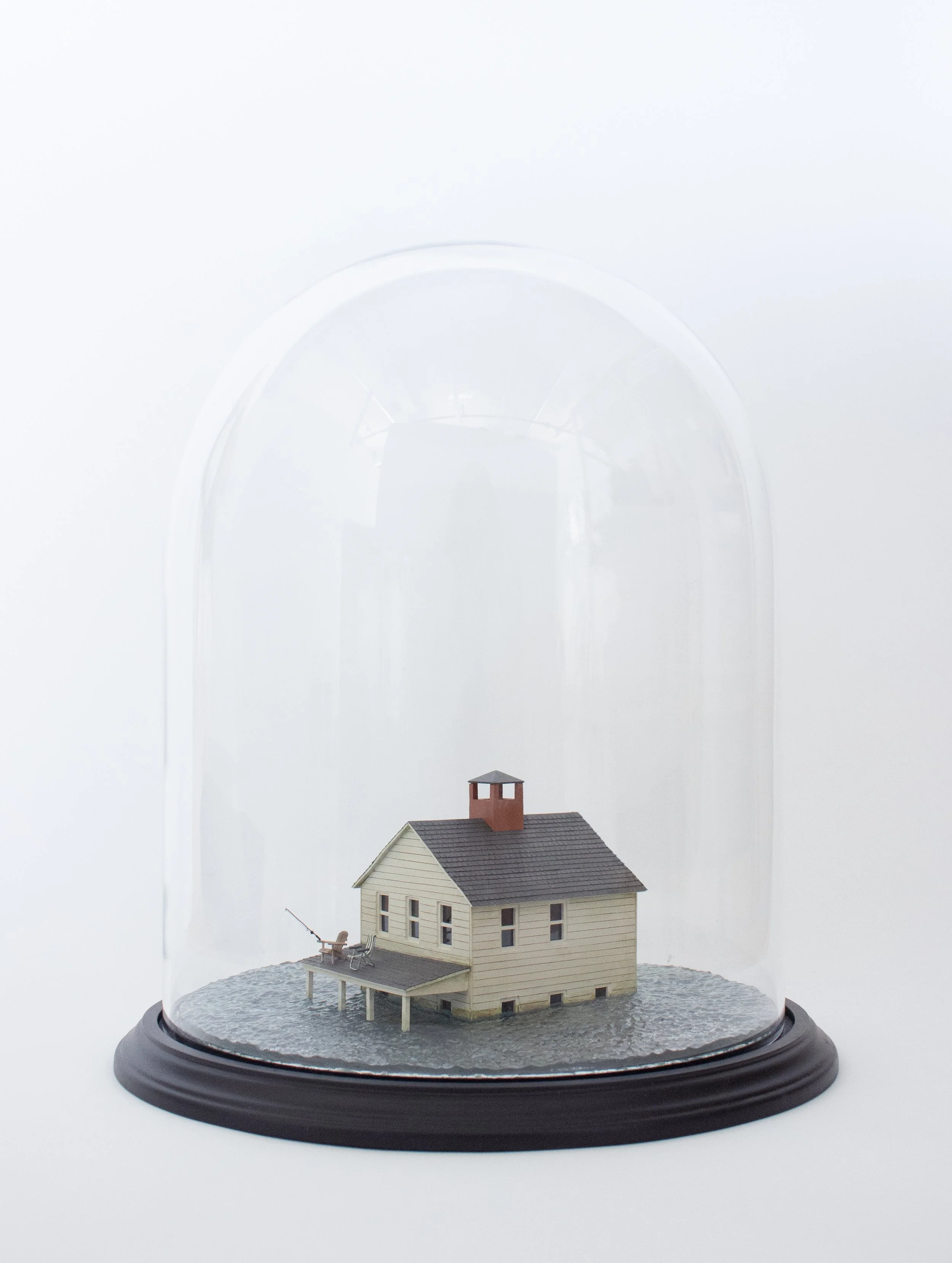   Downtime 2025 16 in × 13 in × 13 in  Glass cloche, resin, wood, plexiglass, sandpaper, wire, cotton fabric, monofilament, acrylic paint 