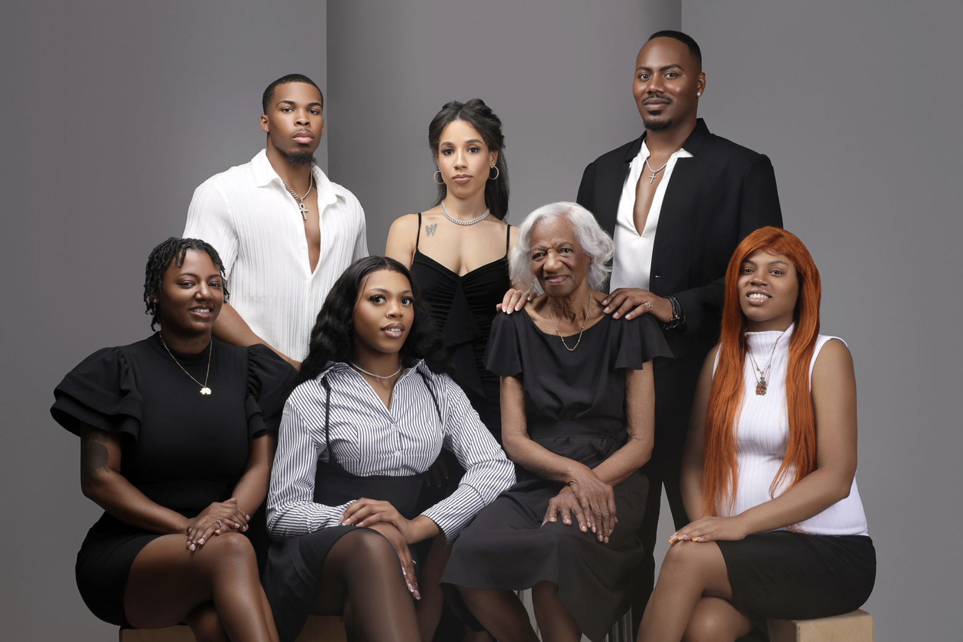 An in studio family portrait session that features a grandmother and her grandchildren of several ages.