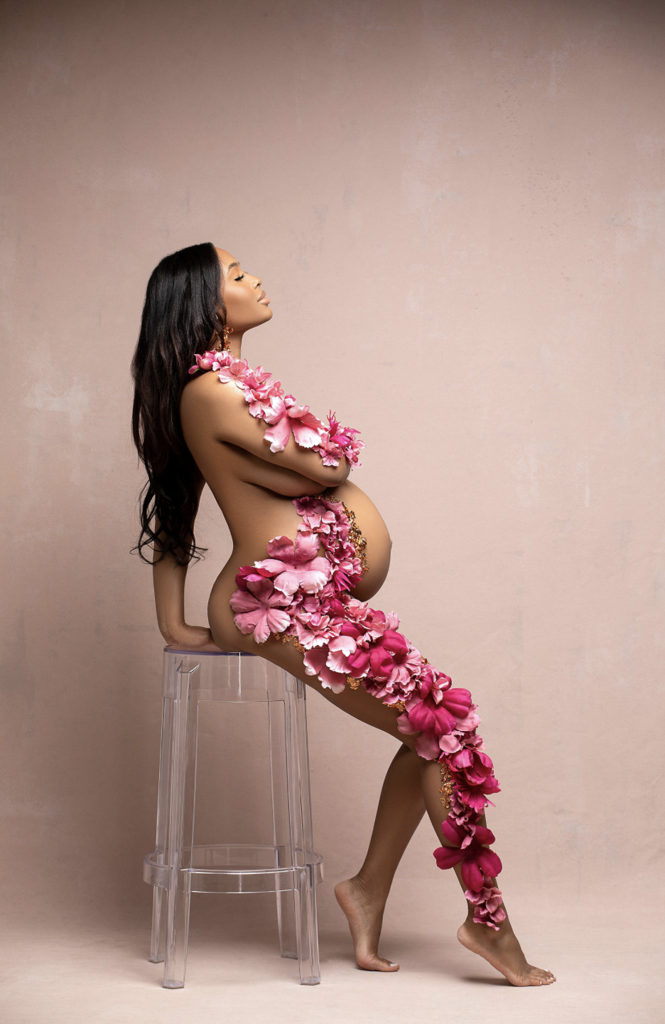 Fine art maternity portrait featuring custom floral body art, highlighting pregnancy and femininity.