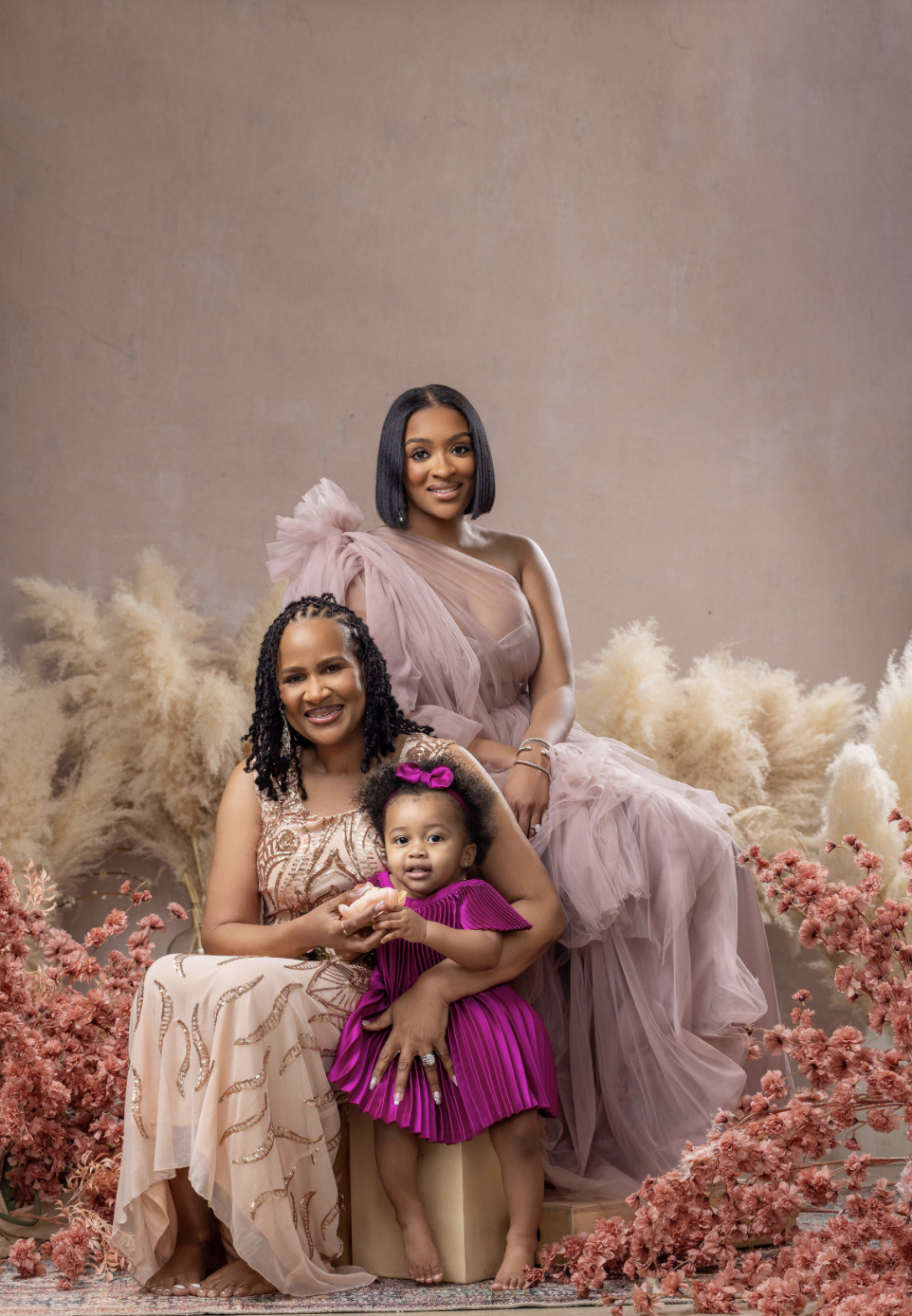 Generations portrait session in New York City featuring a grandmother, mother, and daughter in a styled portrait session in DUMBO Brooklyn