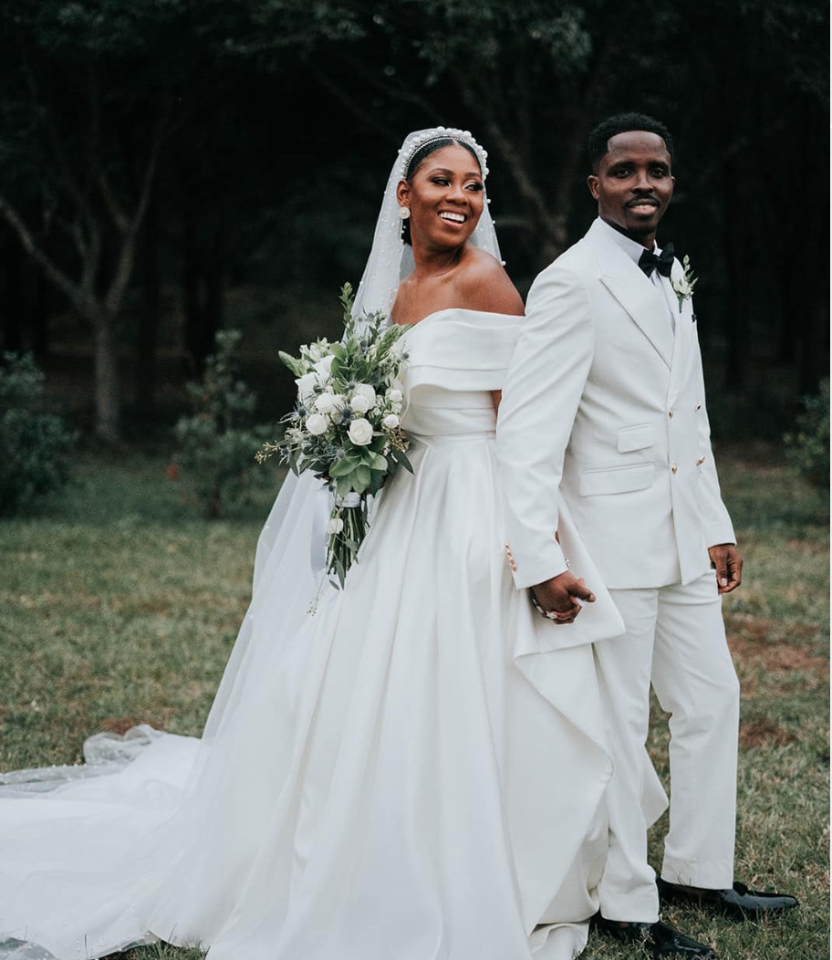 Groom in white tuxedo.