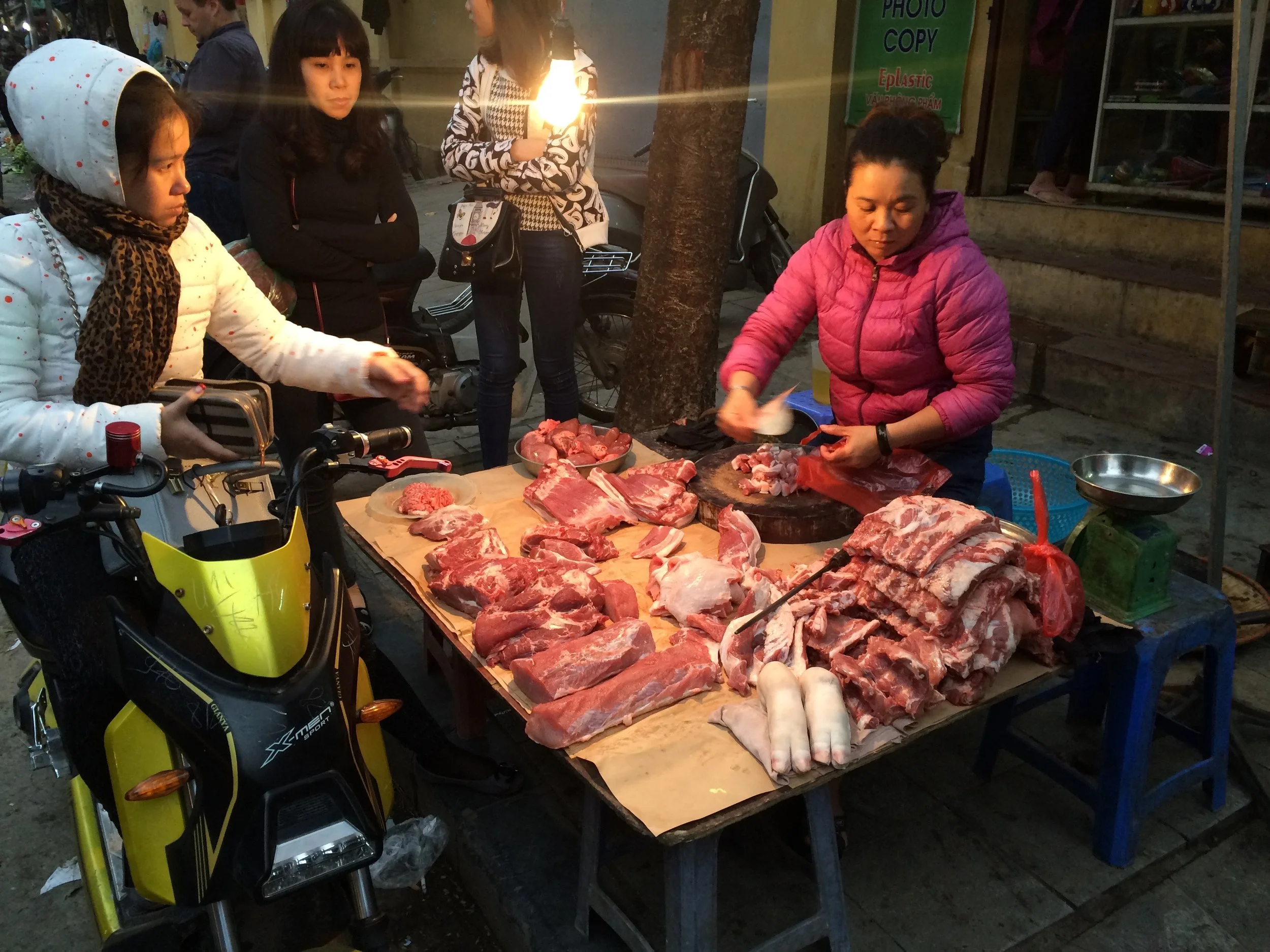 Meat sales in action in Hanoi's Old Quarter Market.