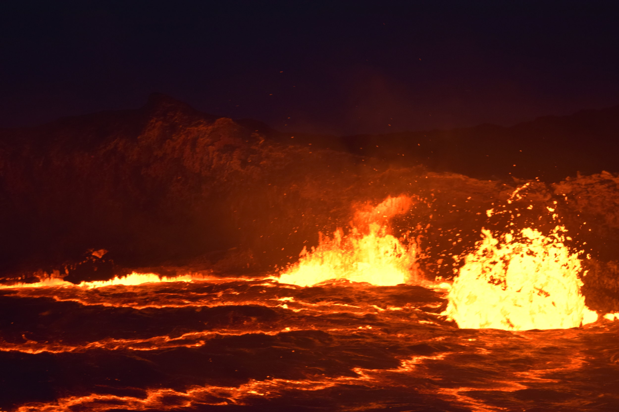 Magma explodes upwards as a side of the crater caved in
