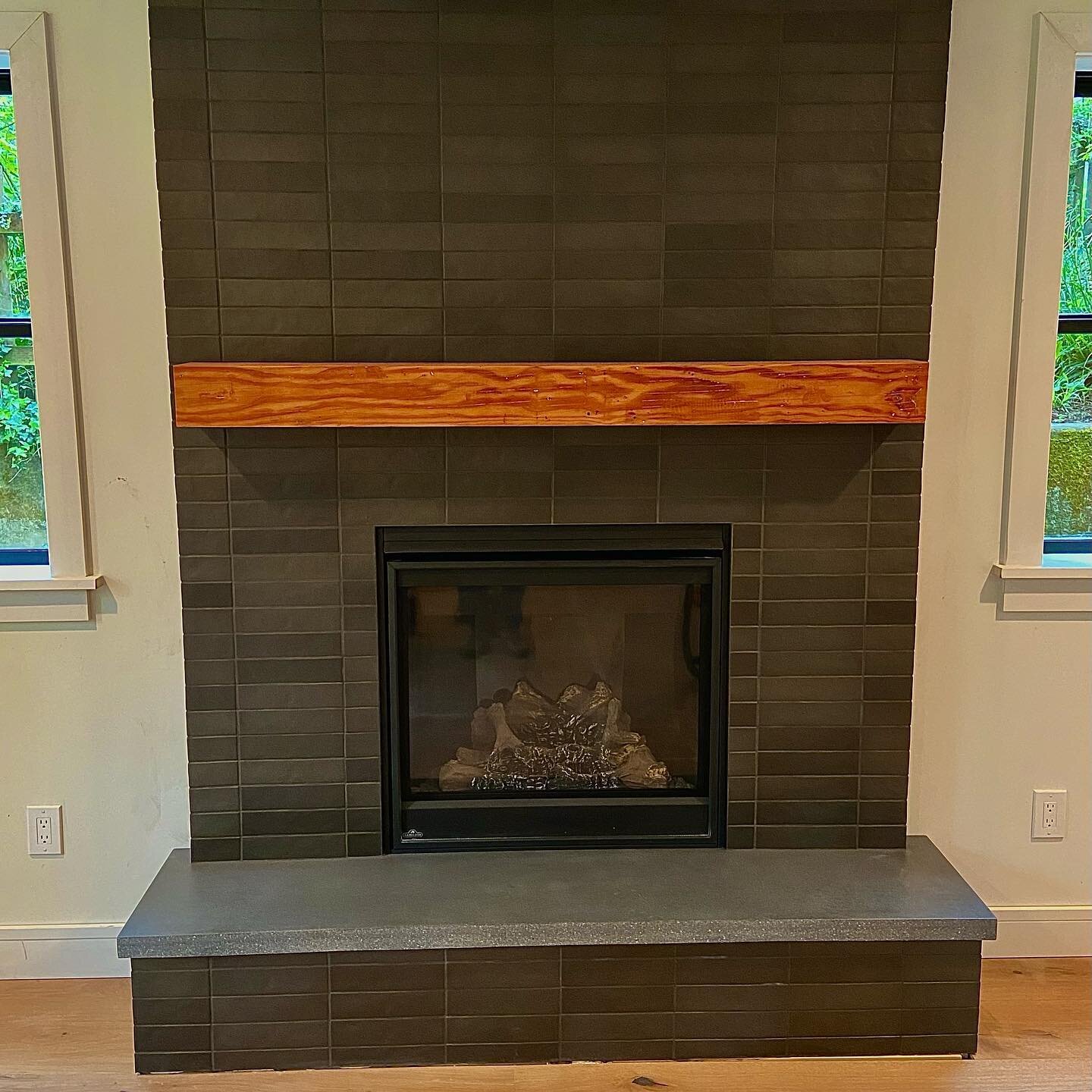 How about that fireplace!  The process of transforming this thing has been really rewarding. From salvaging the beam we removed in the kitchen for the mantel, to pouring the concrete hearth, to setting the tile. When we started we didn&rsquo;t really