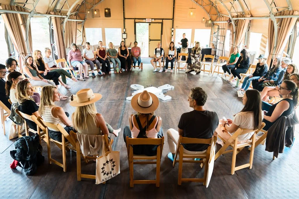Caregivers gathered in circle at a Lead With Love Care for Caregivers retreat