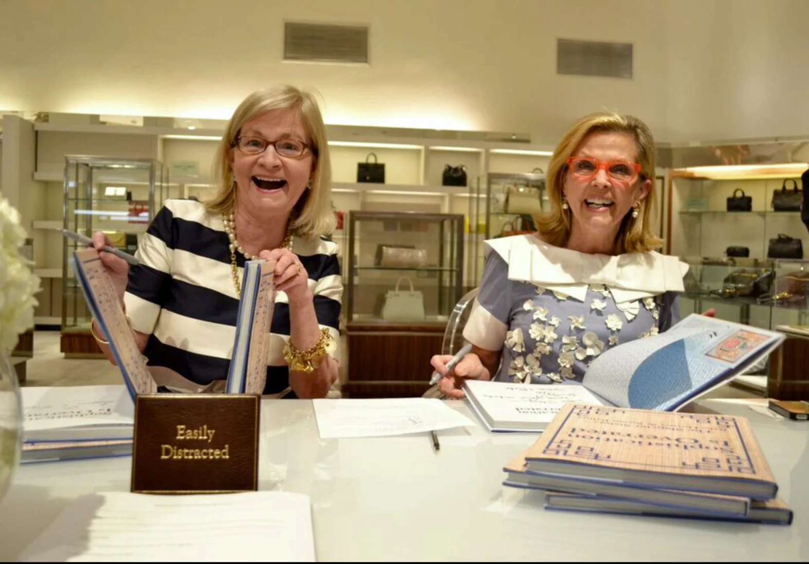 Babs (left) and Susan easily distracted while signing books!