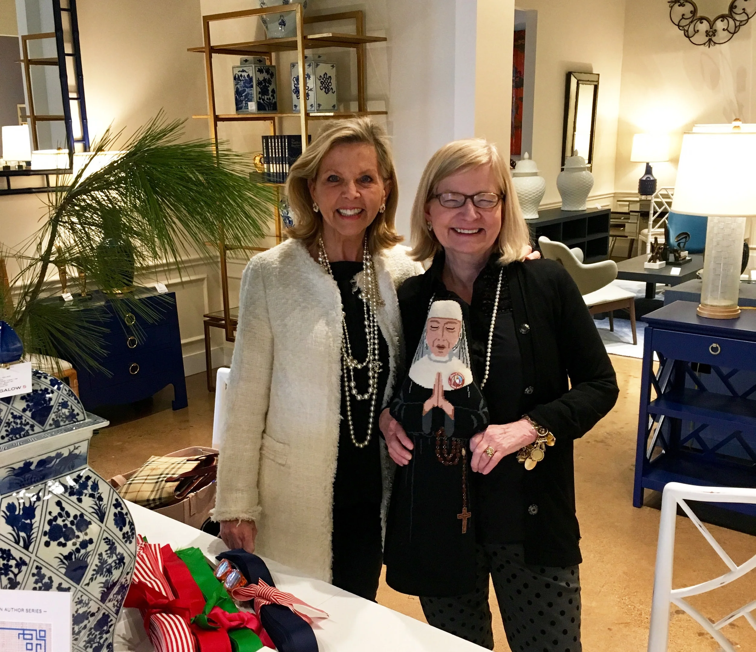 Susan and Babs with their needlepoint Sister.