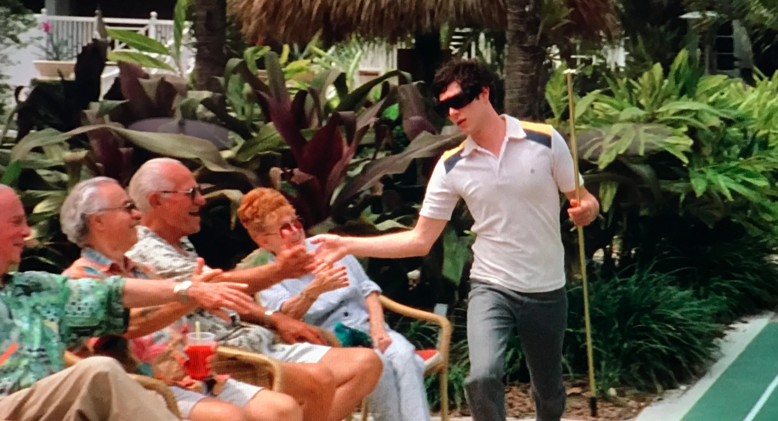 Seth Cohen playing shuffleboard with his Miami friends in The OC Season 2, Episode 21, The Return of the Nana .