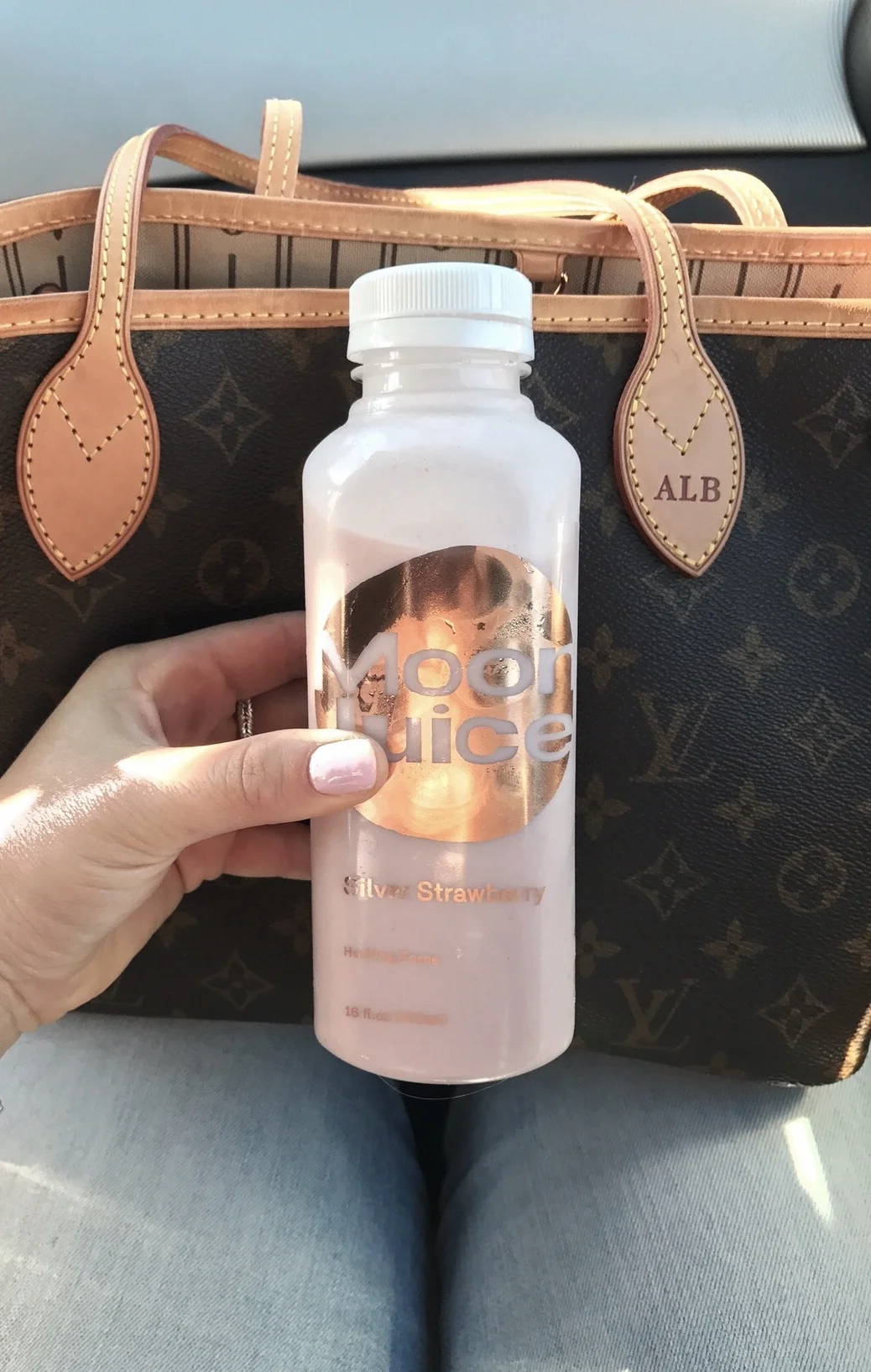 A Silver Strawberry Moon Juice with a fresh mani from Olive & June.