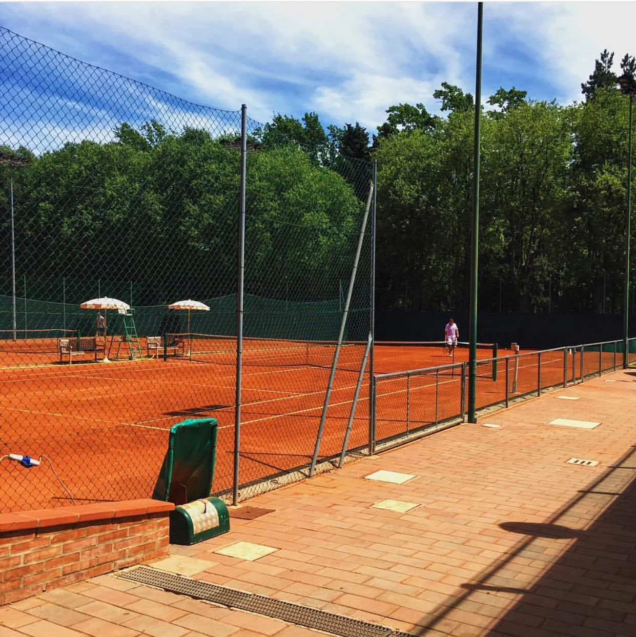 The red clay courts at the exclusive Circolo Tennis Bologna, hidden within the Giardini, as the Bolognese call them.
