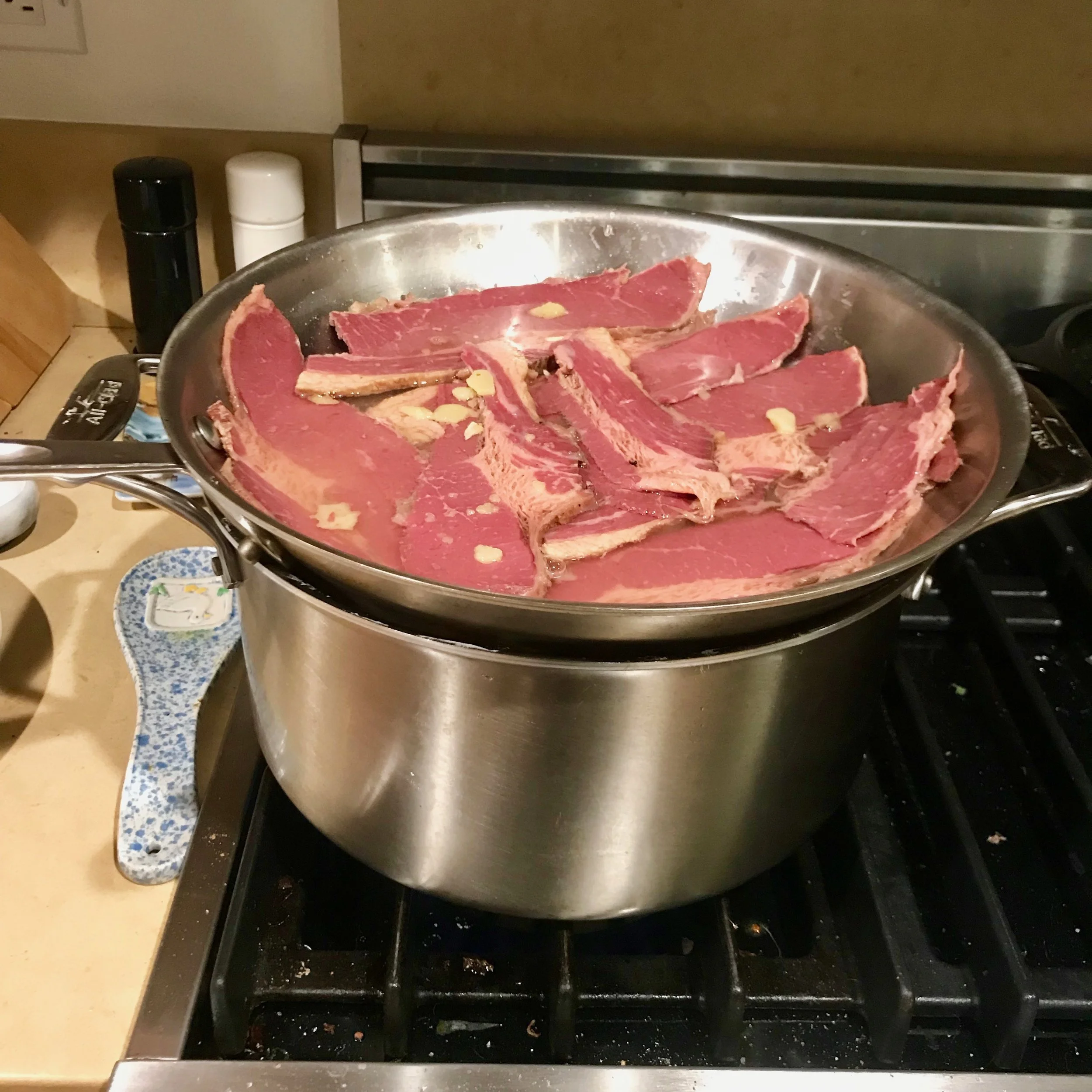 Reheat corned beef in a pan on top of the pot.