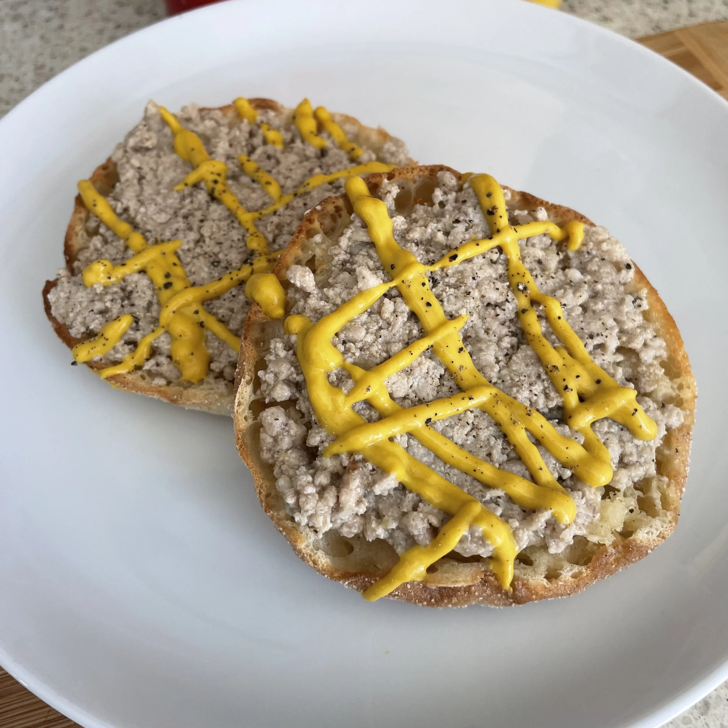 Traditional Québec cretons spread on buttered toast for a classic French-Canadian breakfast