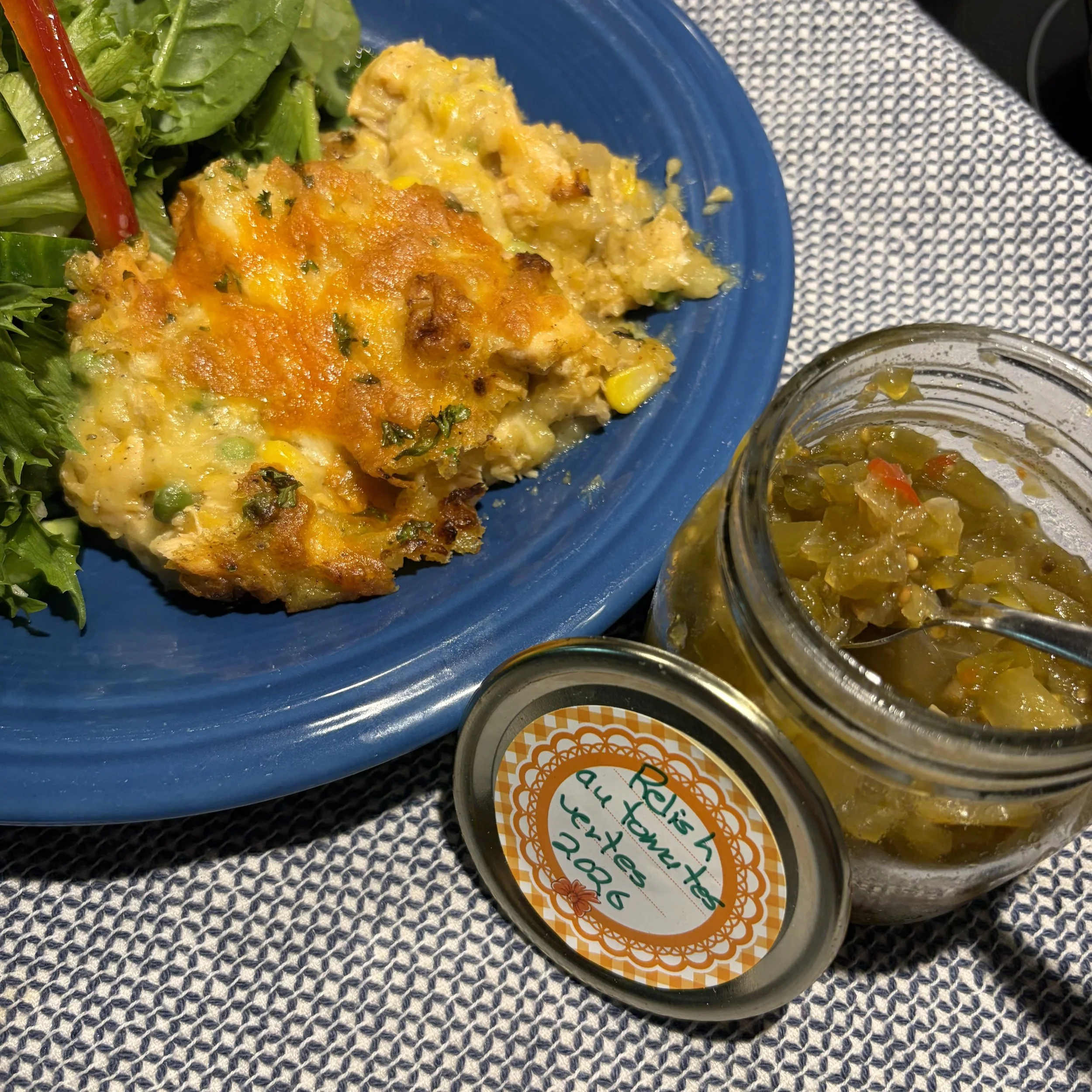 Cheesy salmon and mashed potato casserole made with leftover and served with green tomato relish.