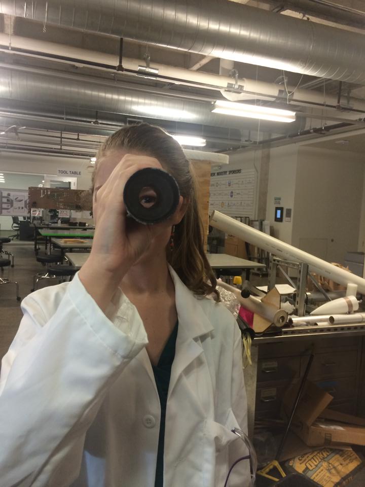 A team member examines a recently cast experimental grain for the Mark I motor