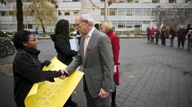 President Reif and Chris Reif talk with members of the "Black Lives Matter" silent protest. 10 December 2014. Source: MIT Office of the President