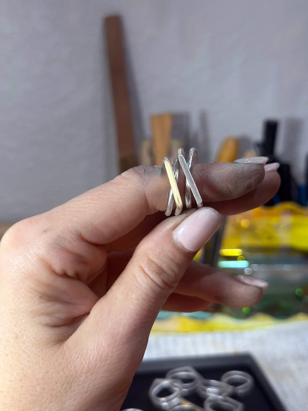 A Crossroads ring in hand at the studio
