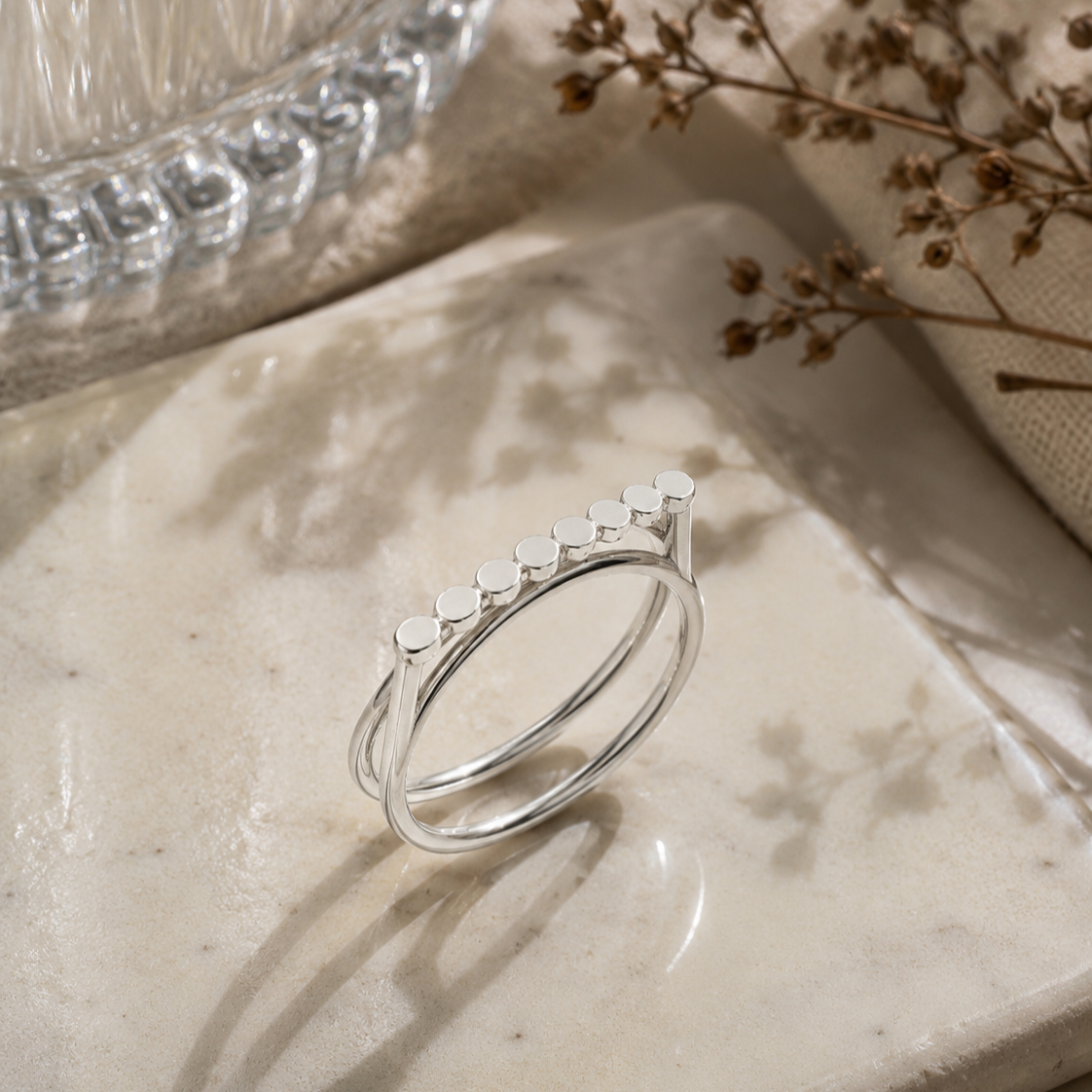 Silver+Stepping+Stone+Ring+on+concrete.png