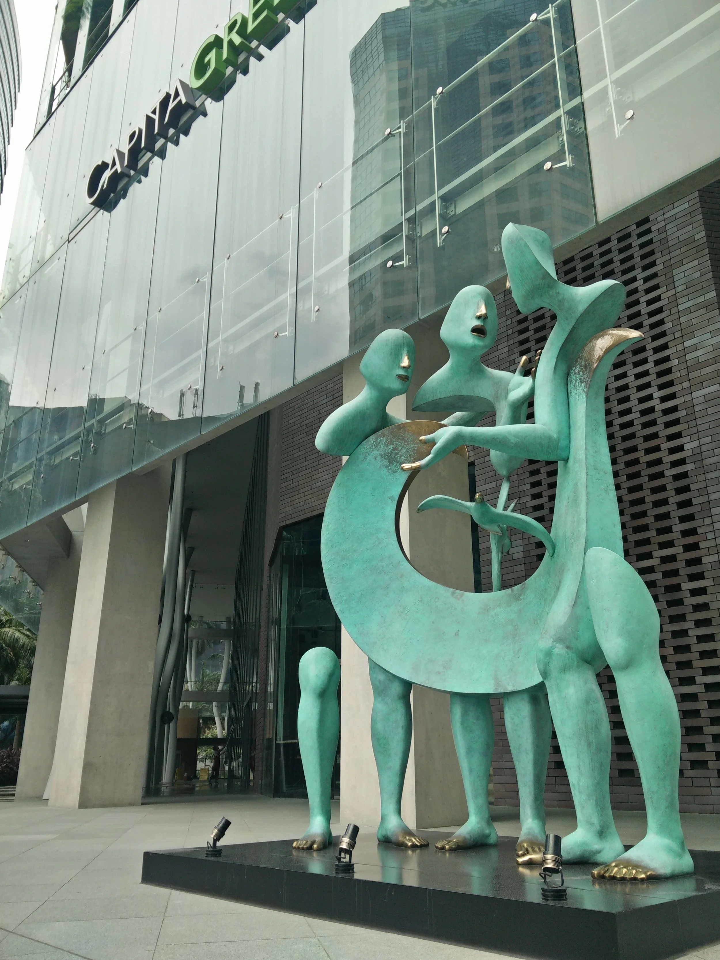 Many public artworks in Singapore are situated on the premises of the companies that own them, such as this sculpture, La Rencontre, by Etienne, in front of the Capital Green building. Due to the density of the cityscape, these areas are however very close to or even part of public walkways, making the artworks easily approachable to the public.
