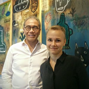 Franklin Po and me against a background of one of the many artworks on the walls of his office.