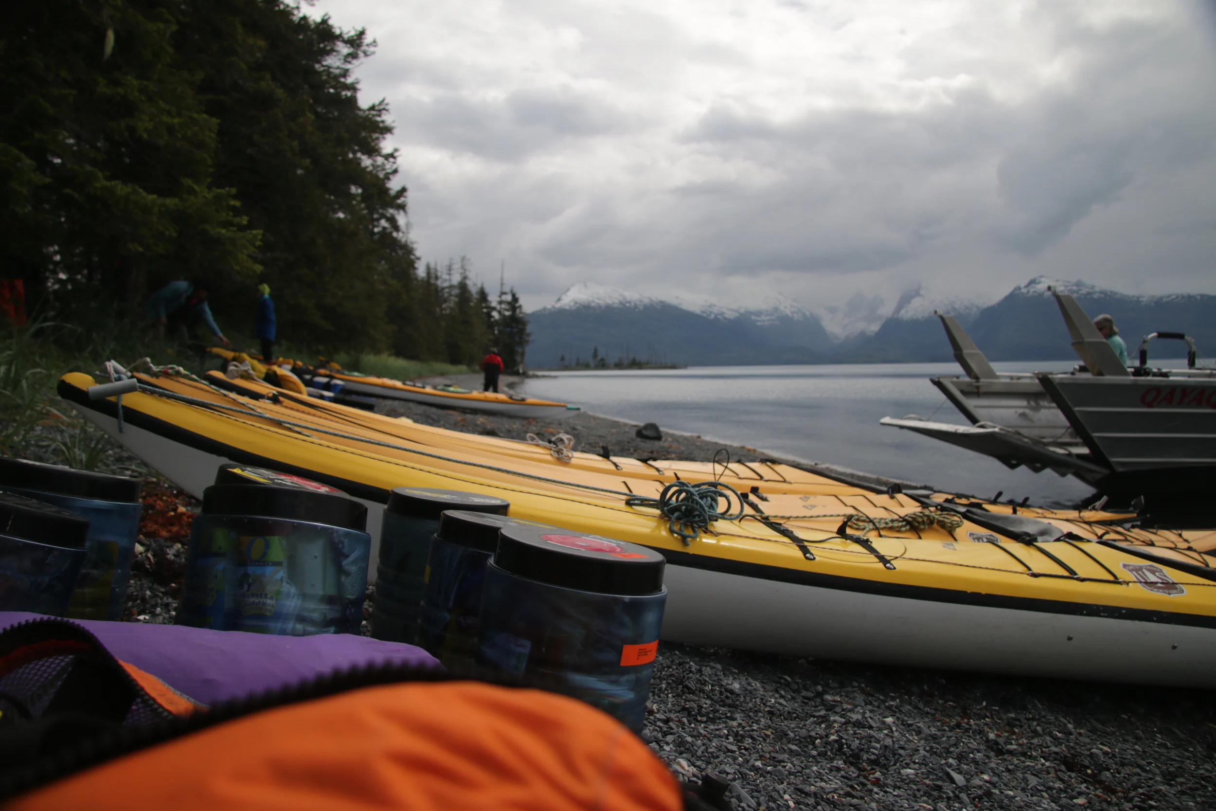 Offloading The Lazy Otter landing boat at Pakenham Point in Prince William Sound. Two standard sea kayaks for Barbara and Trace, one XL kayak for the artist and all his stuff, six bear barrels of food, two tents, thermarests, sleeping bags, rain gear, fuel, paddling jackets, tarps, weeding tools, garbage bags, radios, etc etc. A lot of gear. 