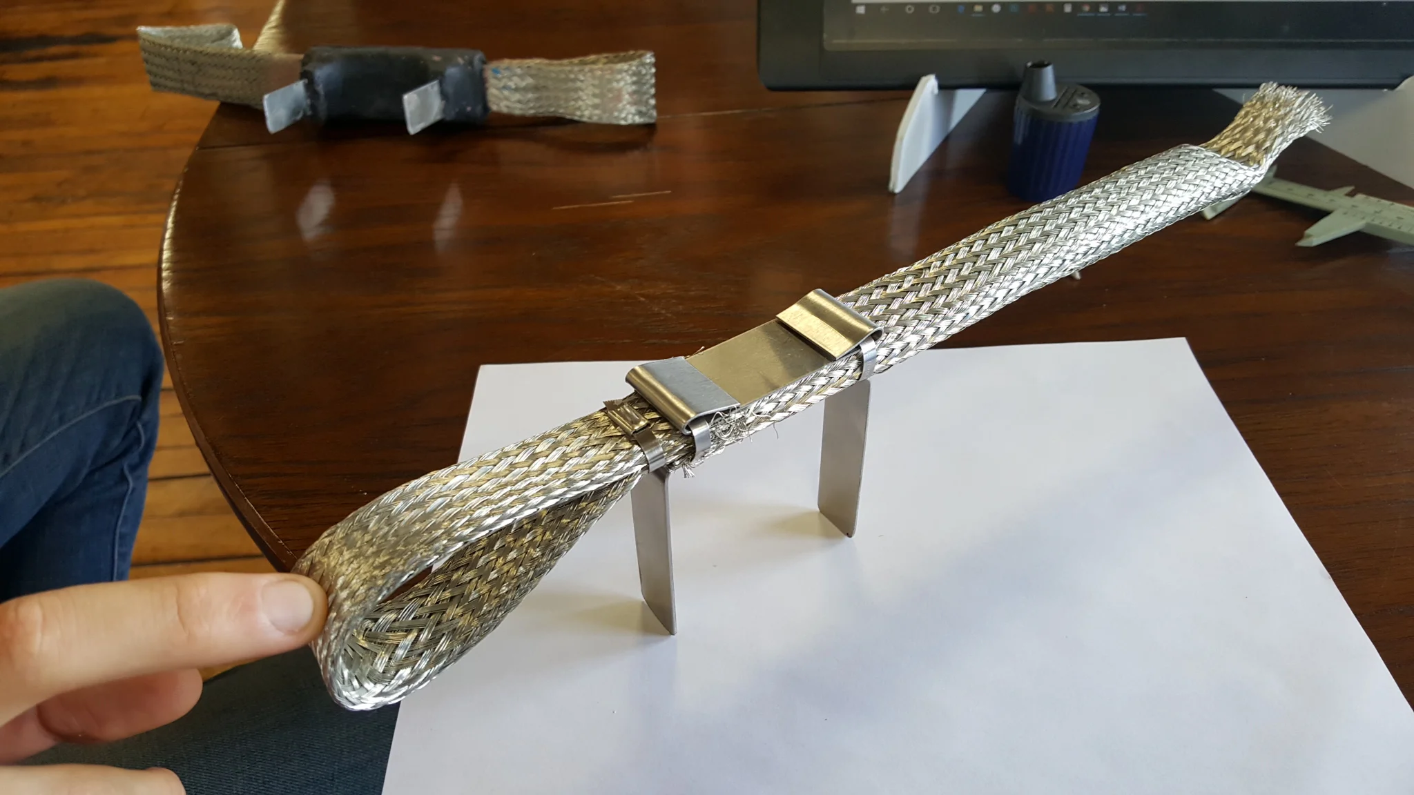 The guts of the discharge tail without over-molding. One end contacts the blade while it rotates and adjusts pitch, the tail end contacts the nacelle and turbine housing while the whole turbine turns. According to Amin, that tail will travel some 50…