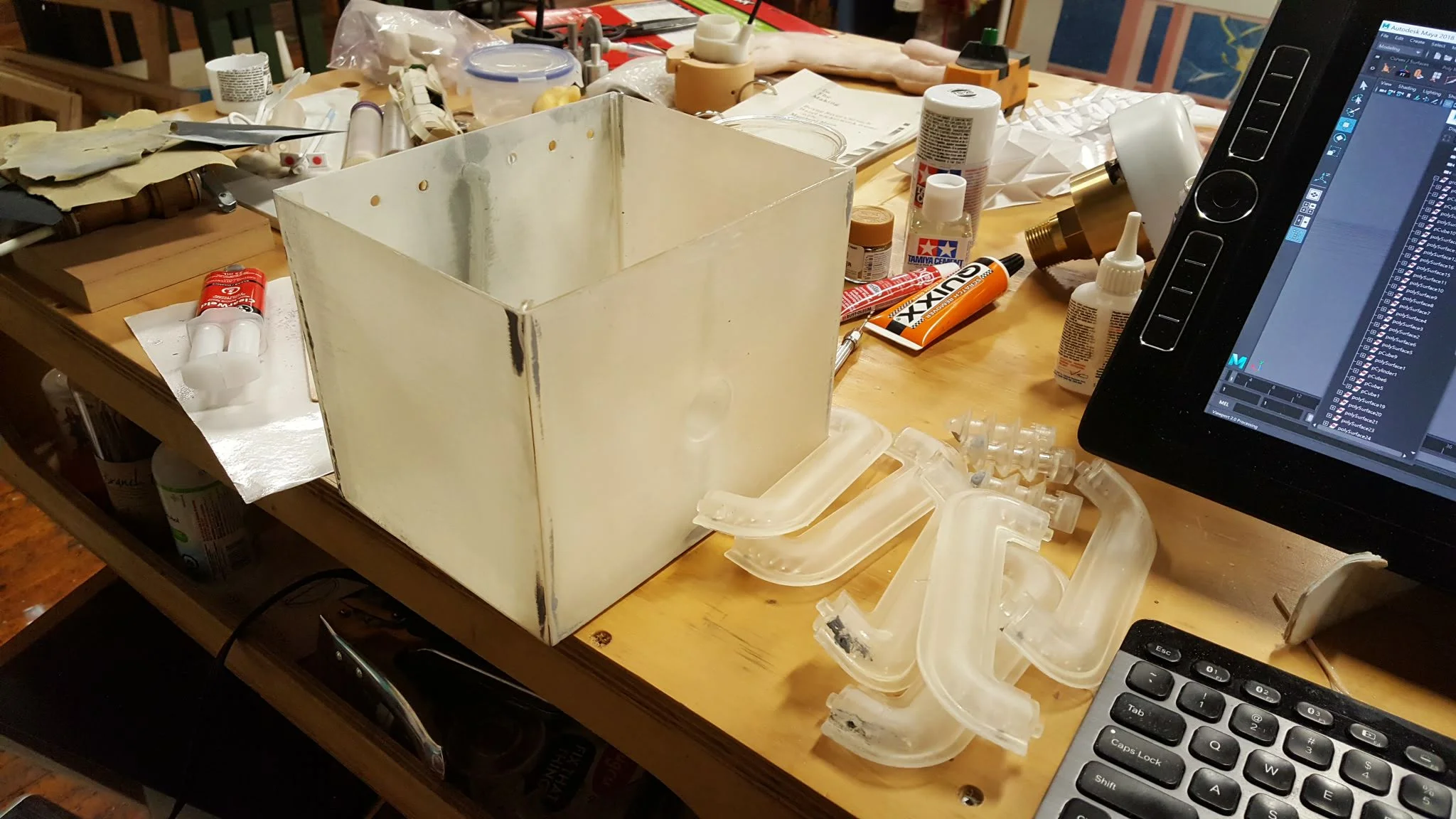 A wack of prints. While I printed the details I started gluing the panels of the transformer together. Gluing and filling and sanding.