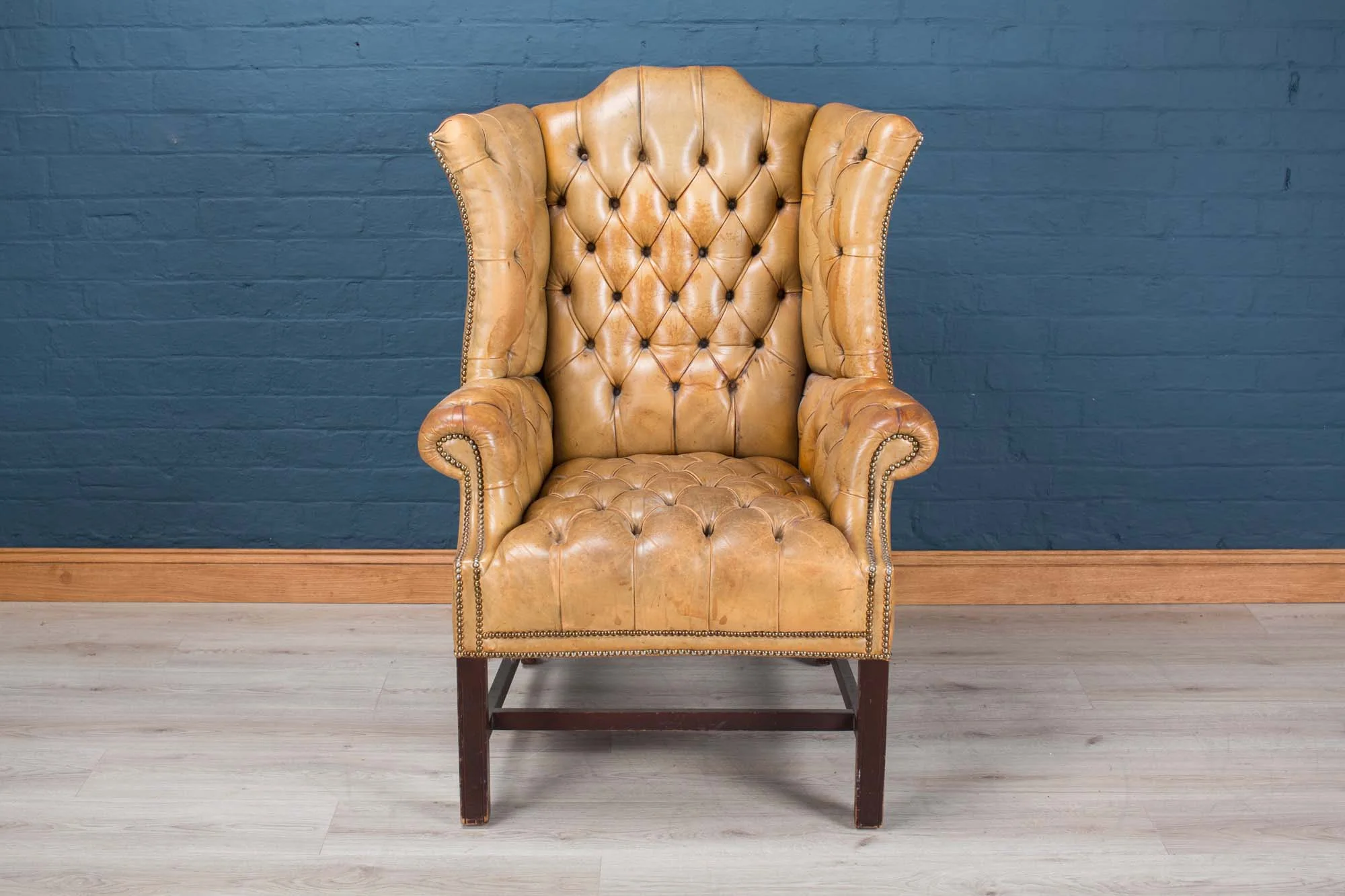 A leather button-down armchair, early 20th century