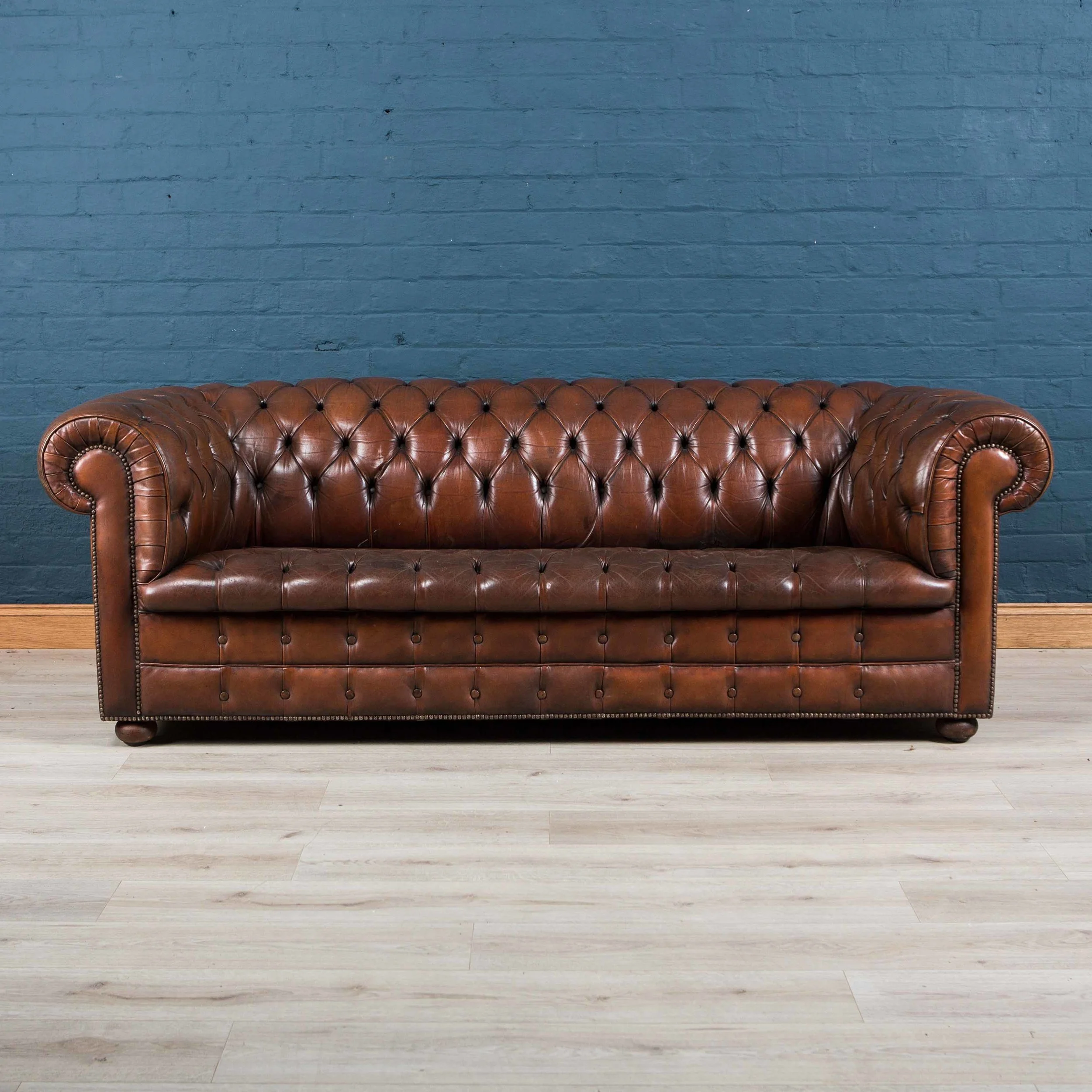 Superb Chesterfield leather sofa with button down seat
