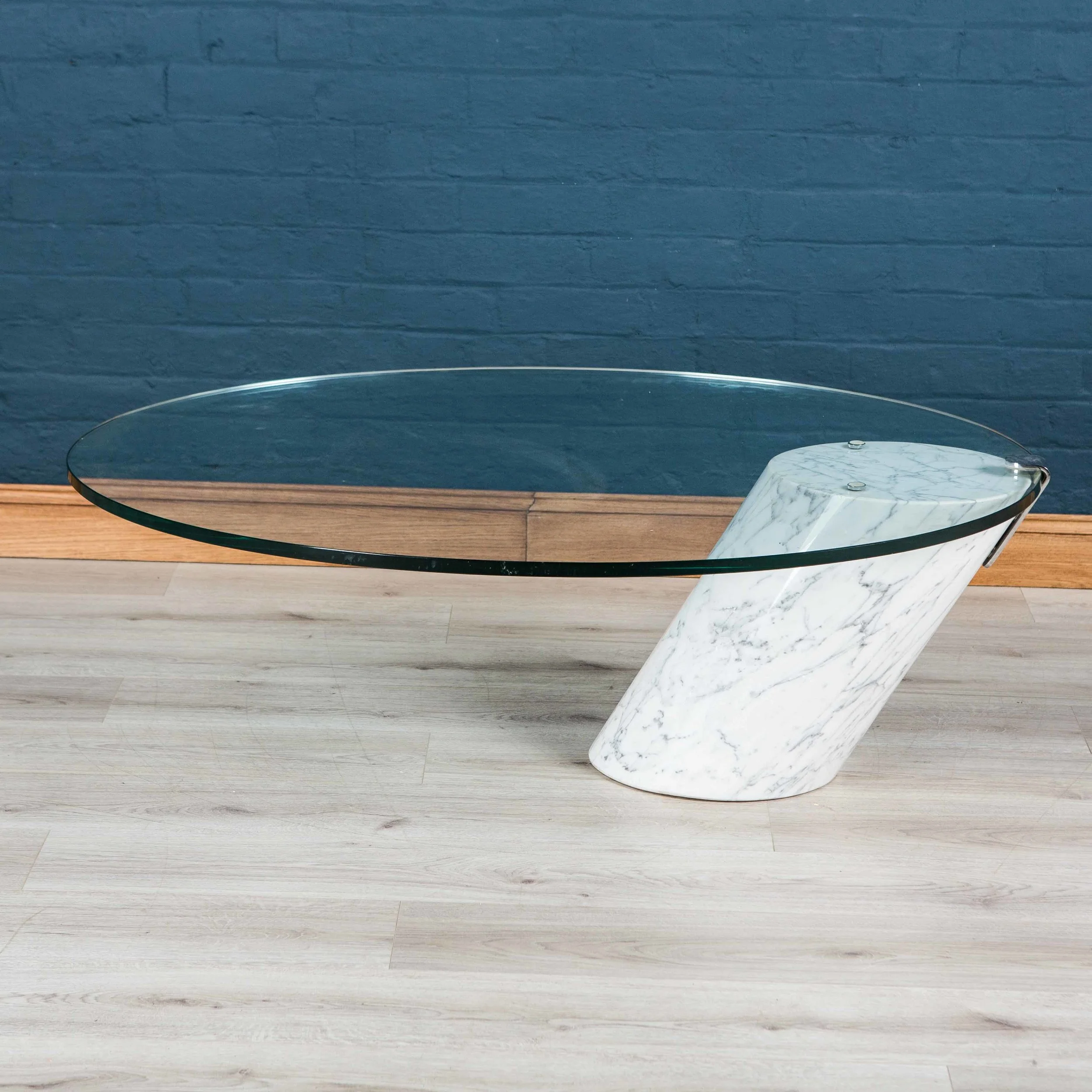 A marble and glass cantilevered coffee table by Brueton, circa 1970