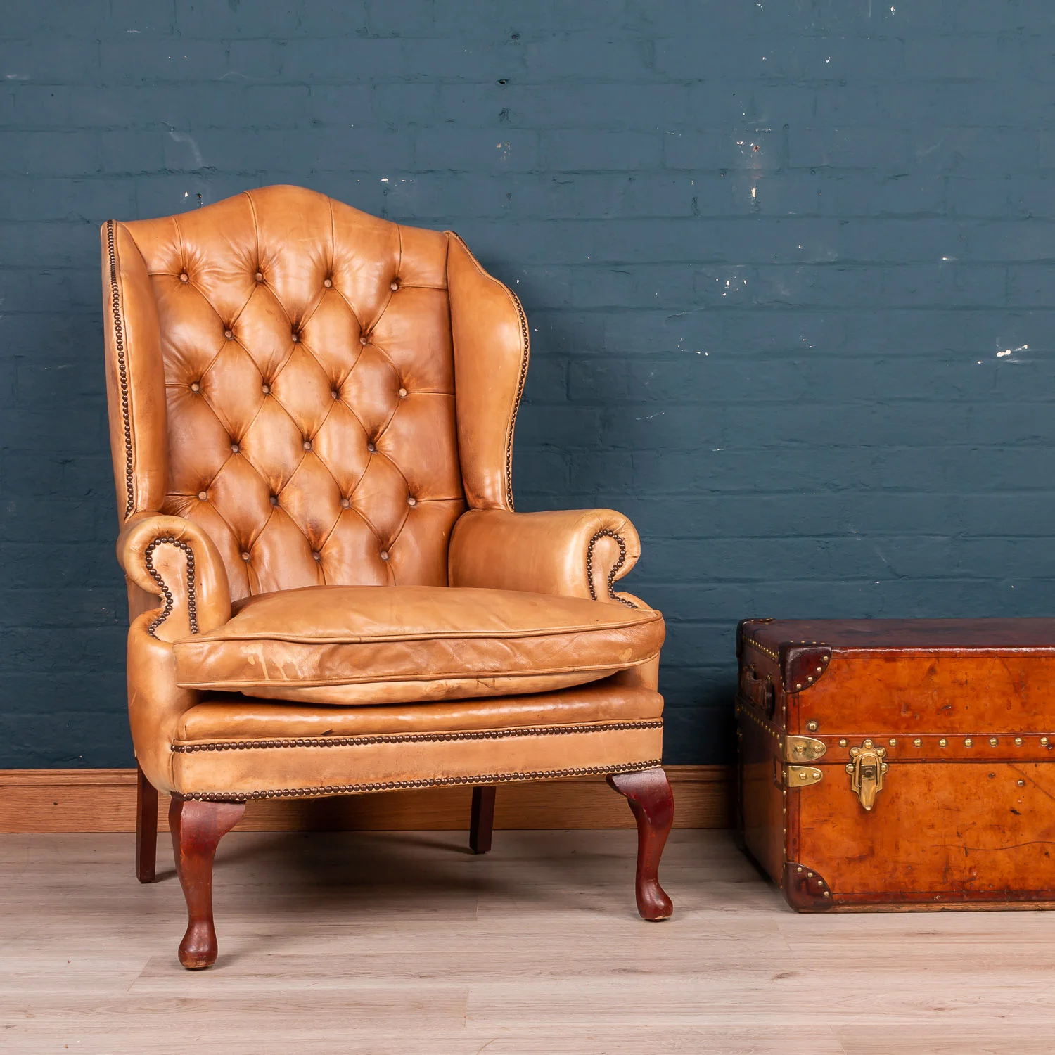 An English leather wing back chair, late 20th century