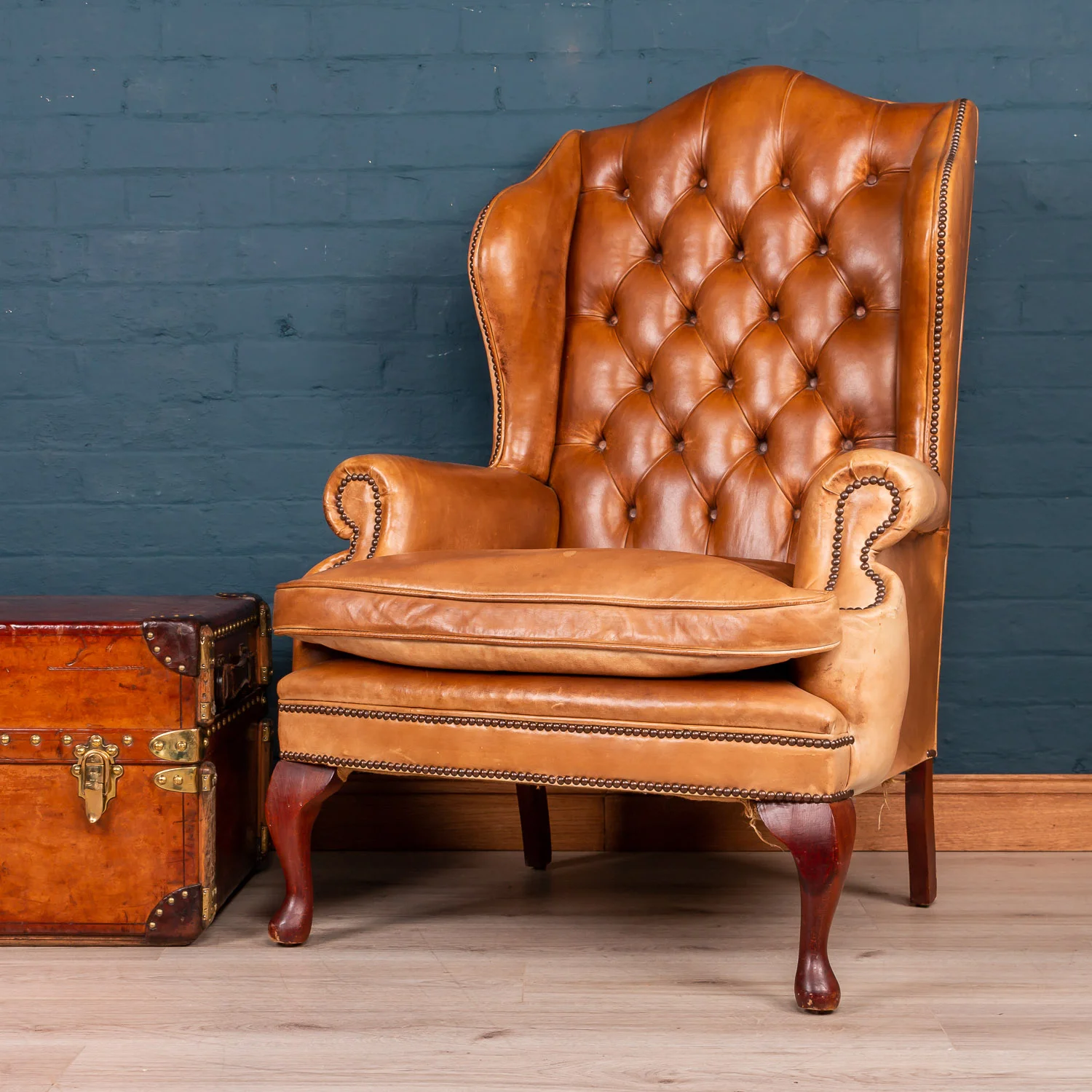 An English leather wing back chair, late 20th century