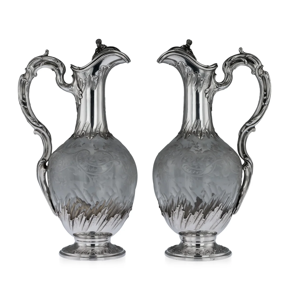 A pair of silver and glass claret jugs, France, circa 1890