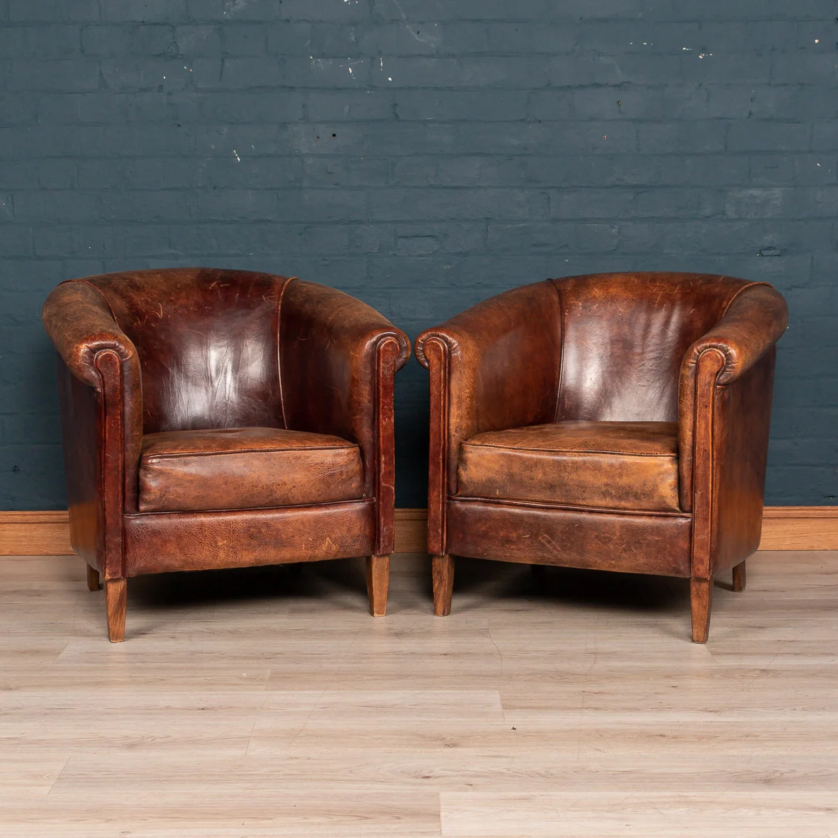 A pair of sheepskin leather tub chairs, Holland, late 20th century