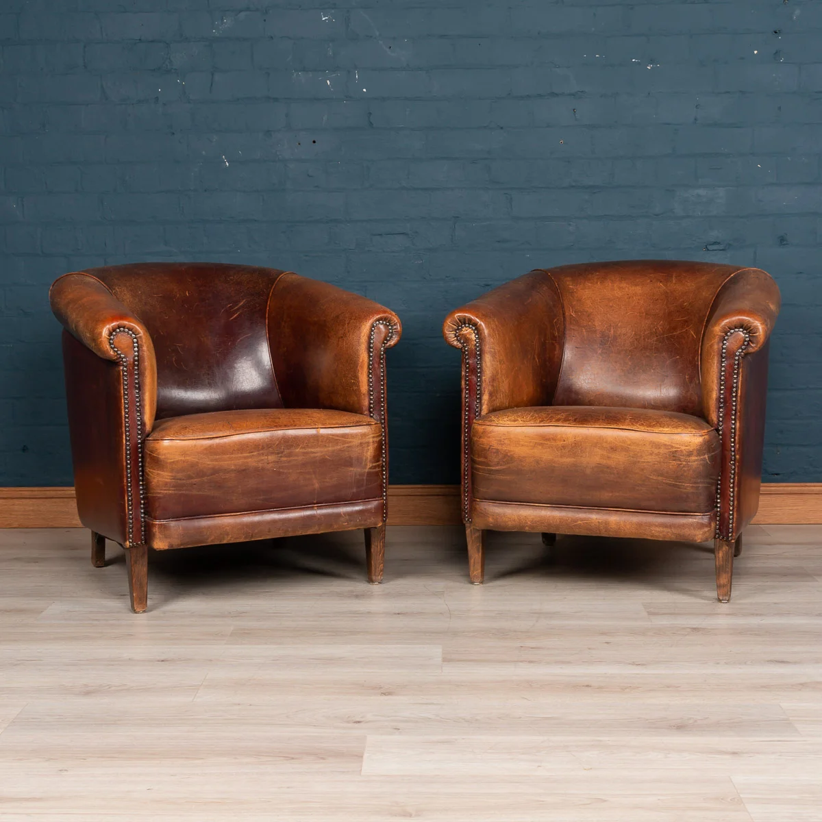 A pair of sheepskin leather tub chairs, Holland, late 20th century