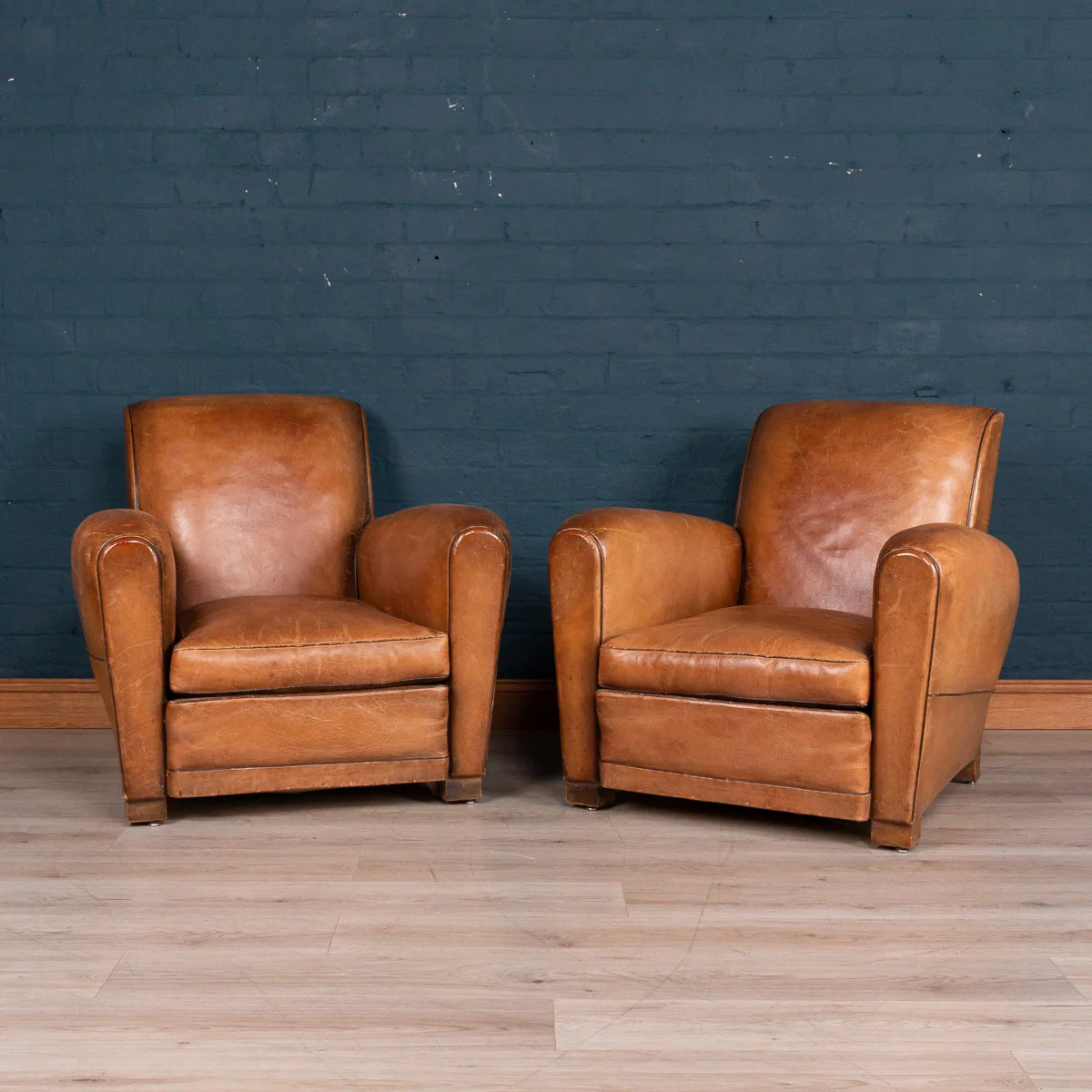 A pair of leather club chairs, France, circa 1930