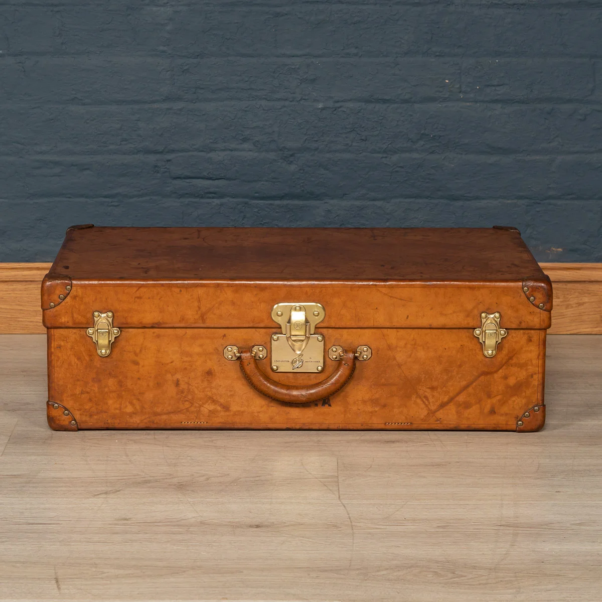 A Louis Vuitton suitcase in natural cowhide, France, circa 1900