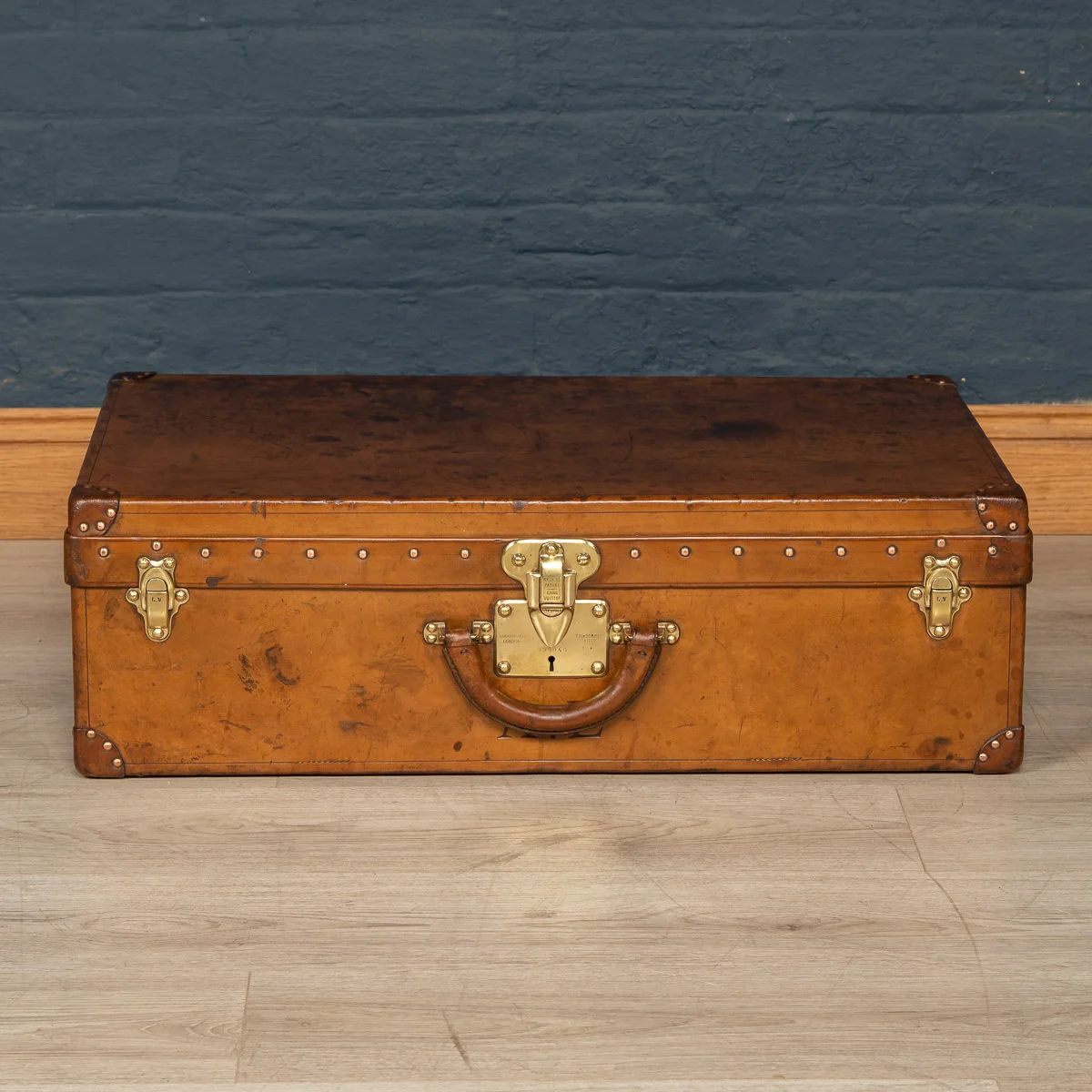 A Louis Vuitton suitcase in natural cow hide, France, circa 1900