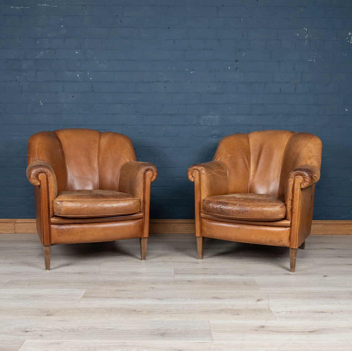A pair of sheepskin leather tub chairs, Holland, mid to late 20th century